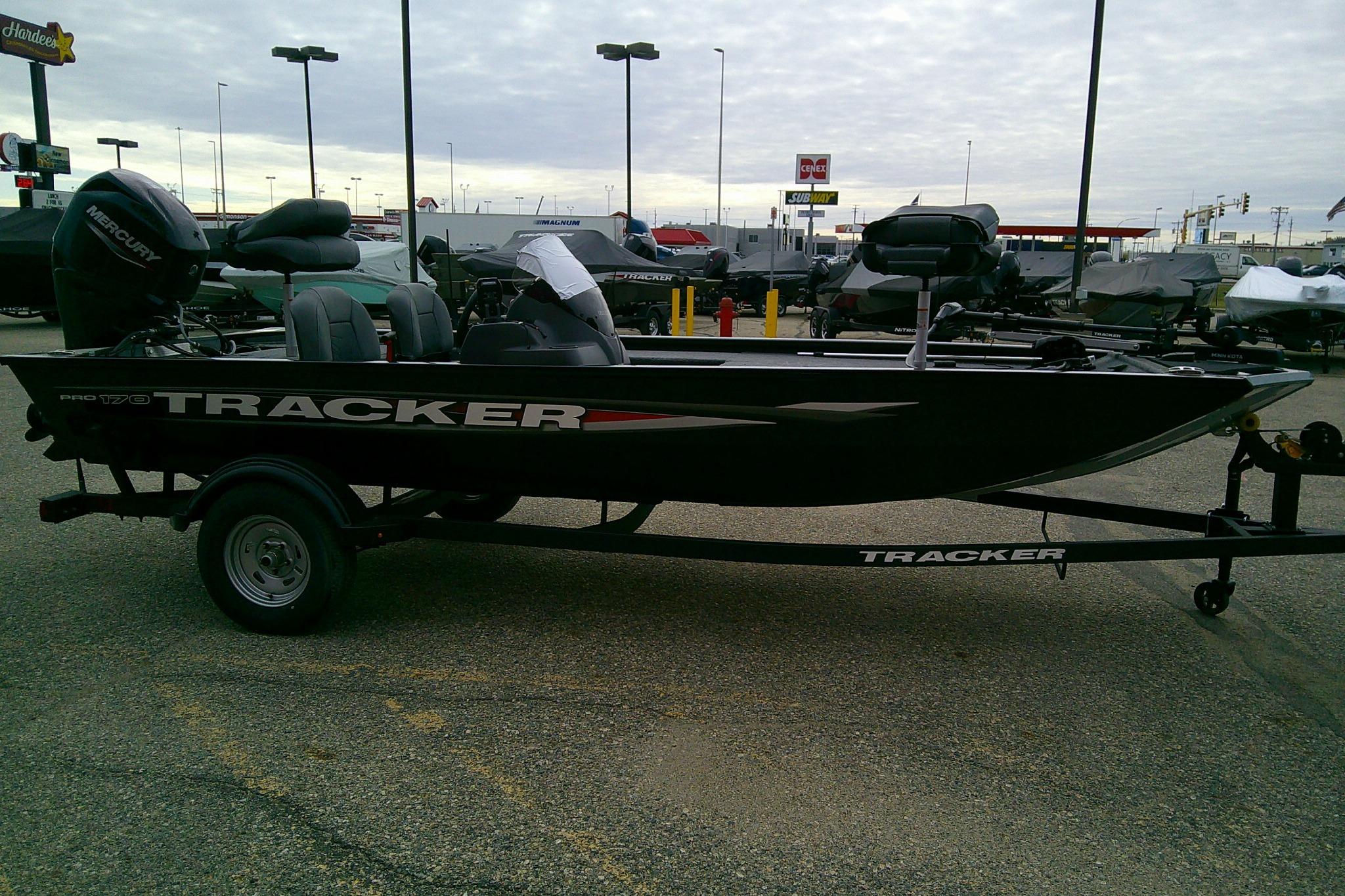 2025 Tracker Pro 170 boat on trailer in parking lot.