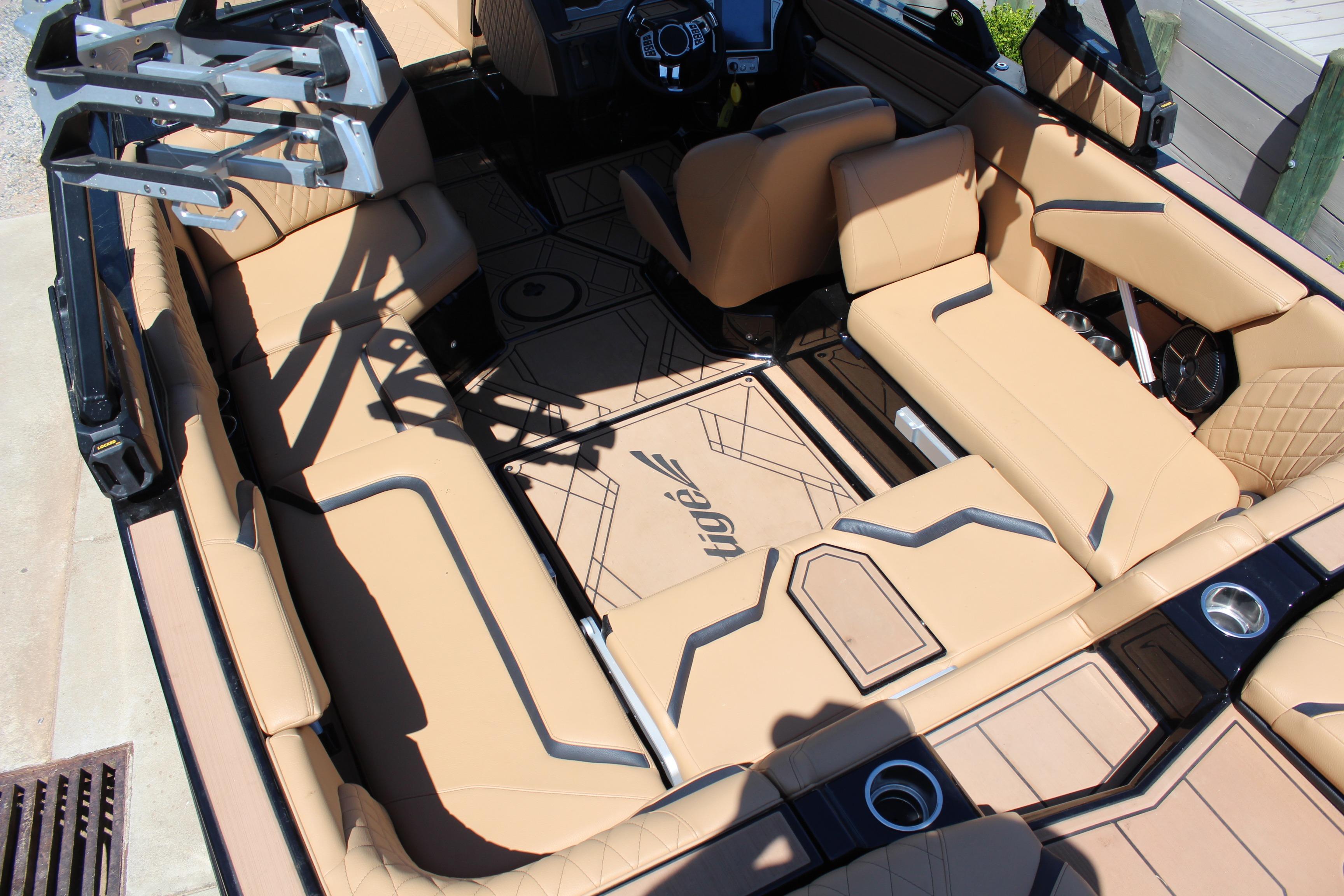 2022 Tigé 22RZX boat interior with tan leather seating and modern design.