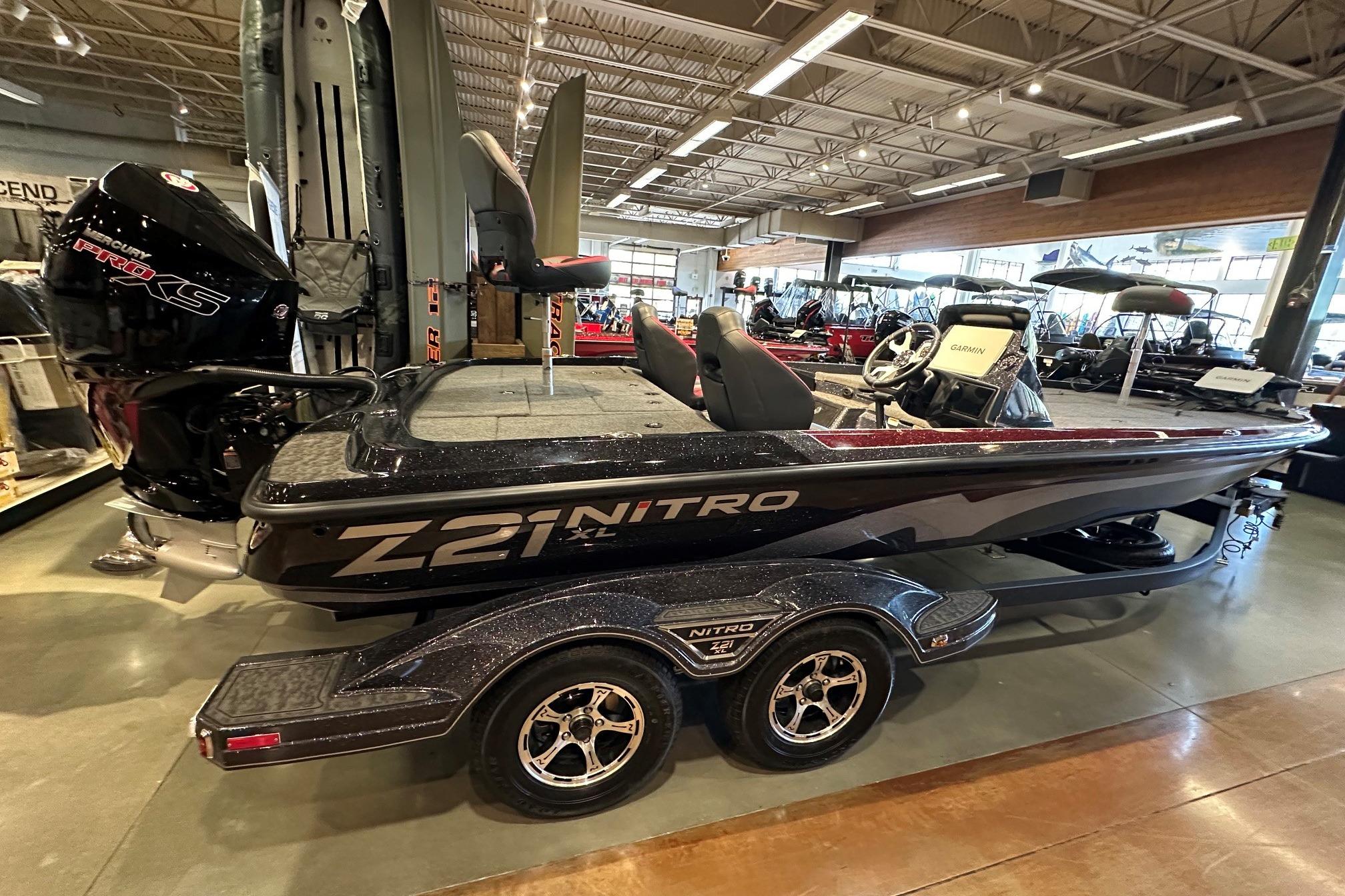 2026 Nitro Z21 XL Pro boat displayed indoors, featuring sleek design and powerful engine.