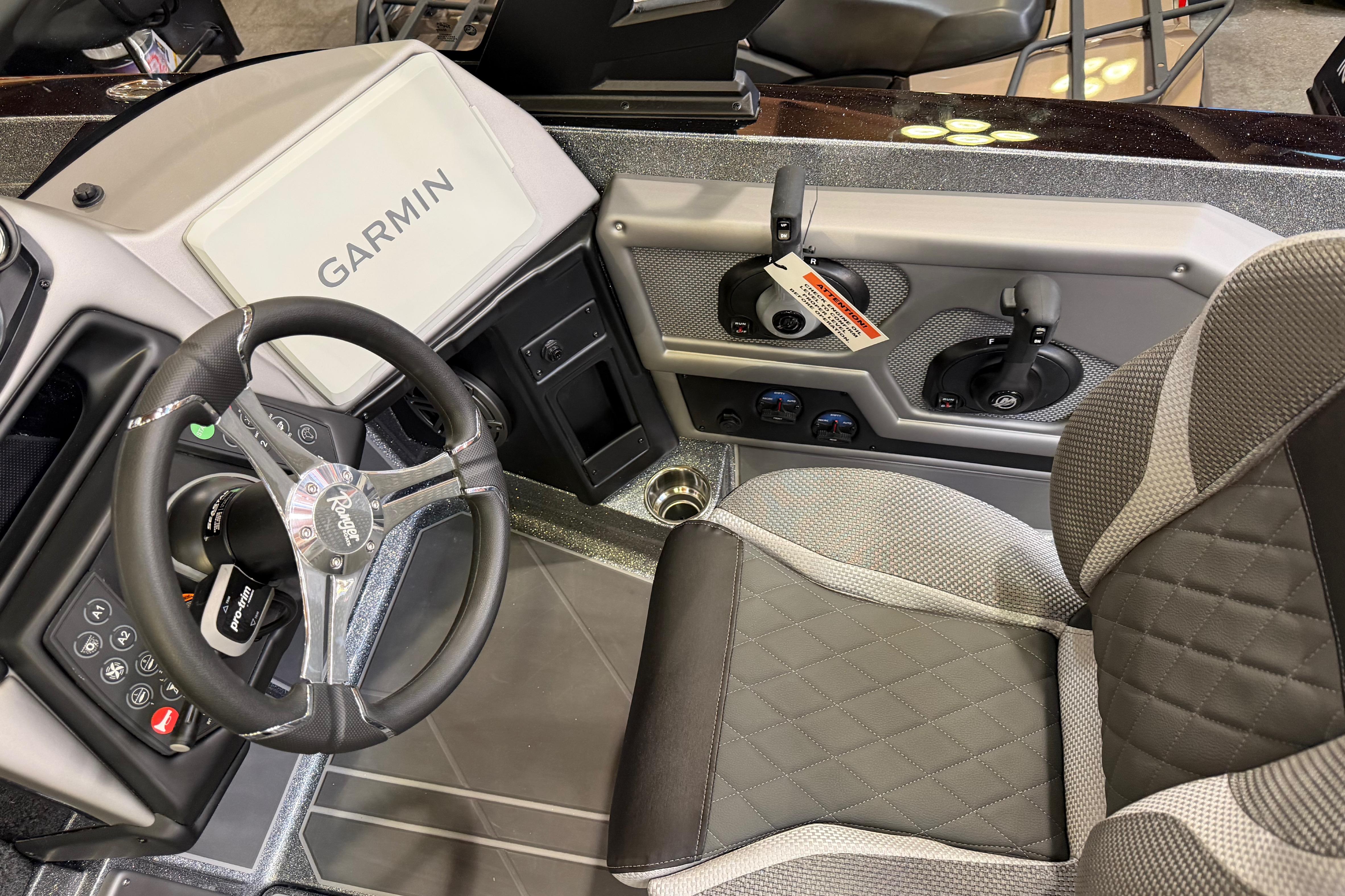 2026 Ranger 621FS Cup-Equipped boat cockpit with Garmin display and premium seating.