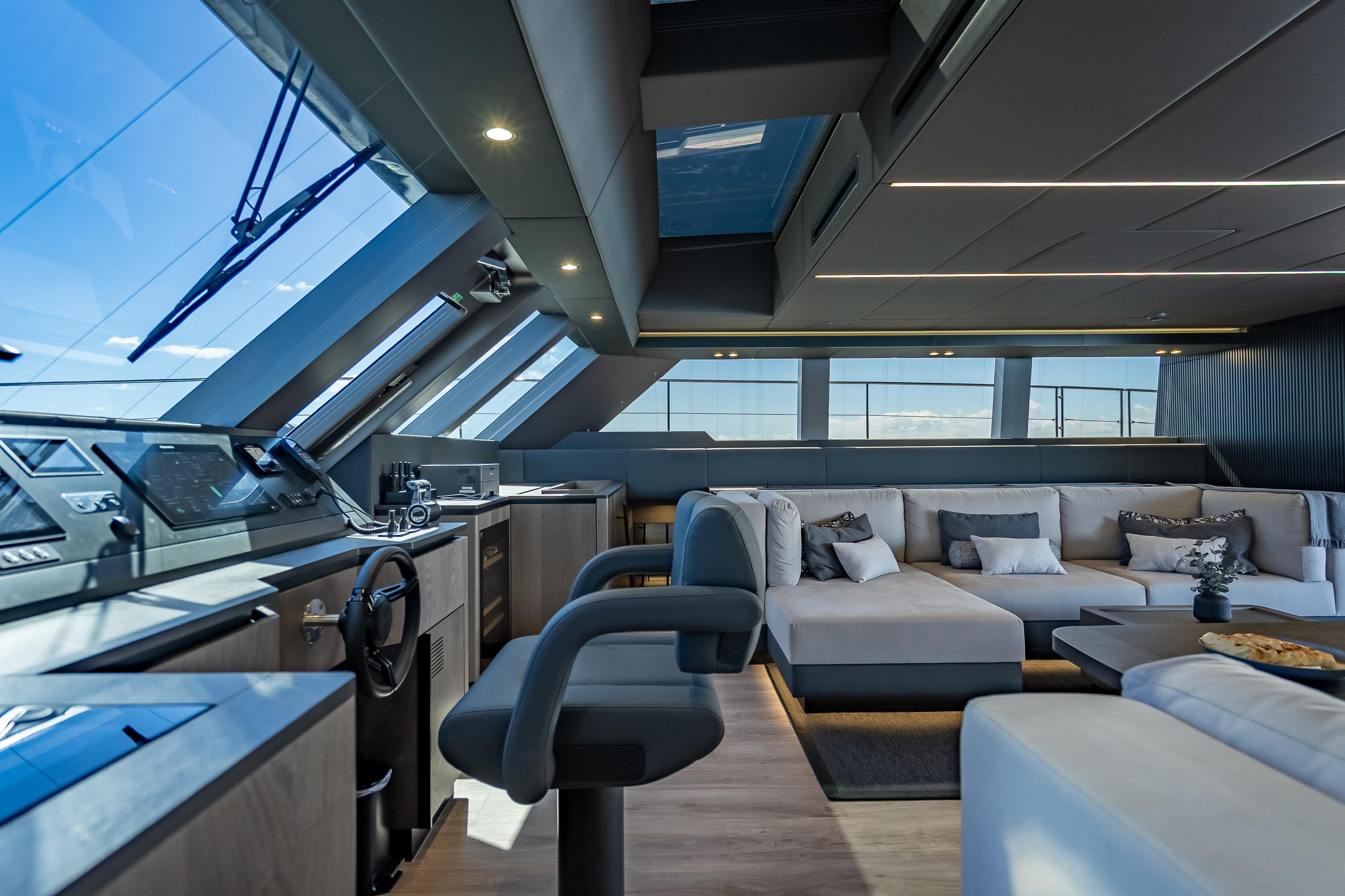 Luxurious interior of 2026 Sunreef 60 Power yacht with modern seating and panoramic windows.