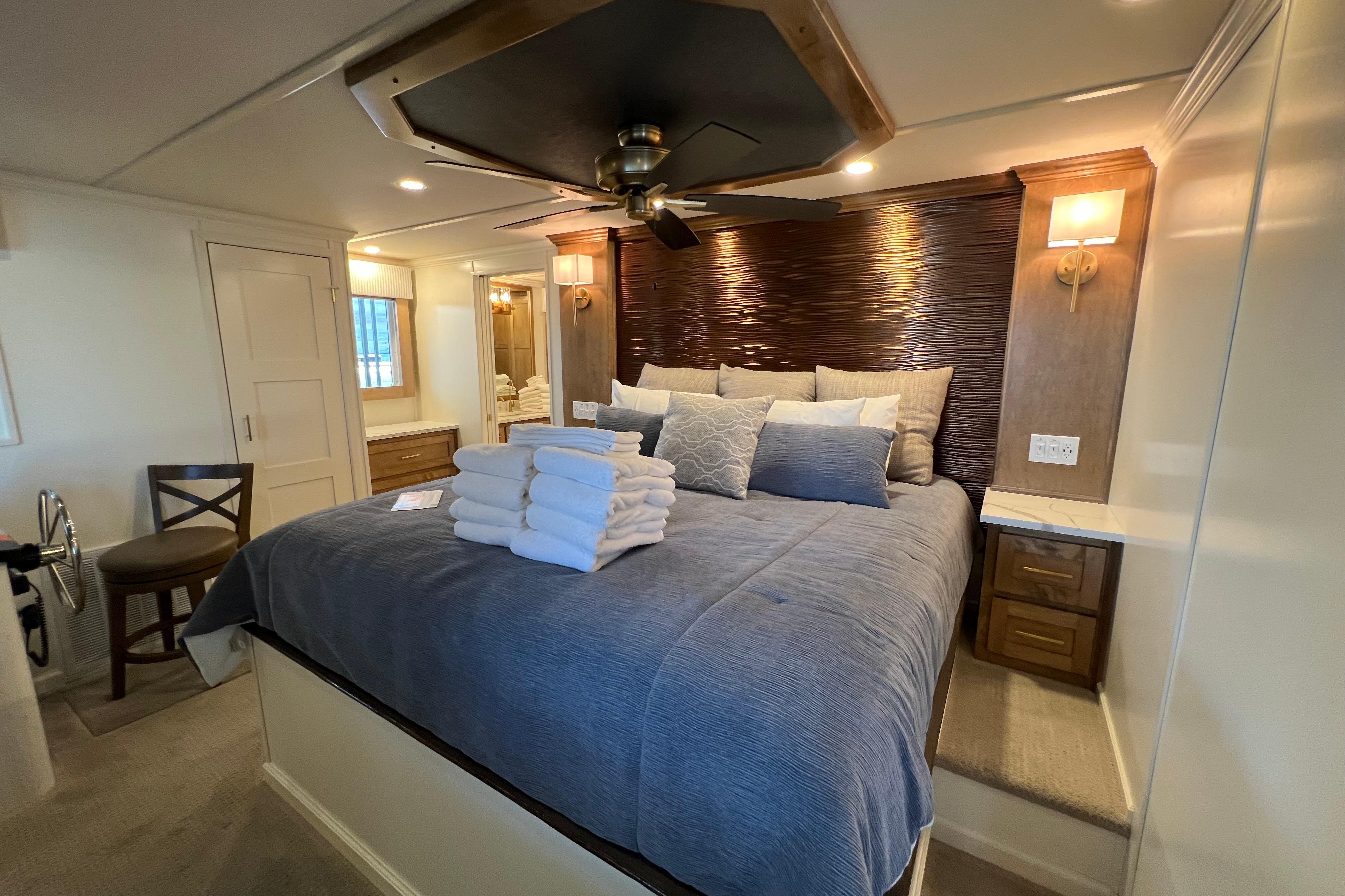 Luxurious bedroom in 2025 Sumerset Excellence Multiple Shares houseboat, featuring elegant decor and cozy bedding.
