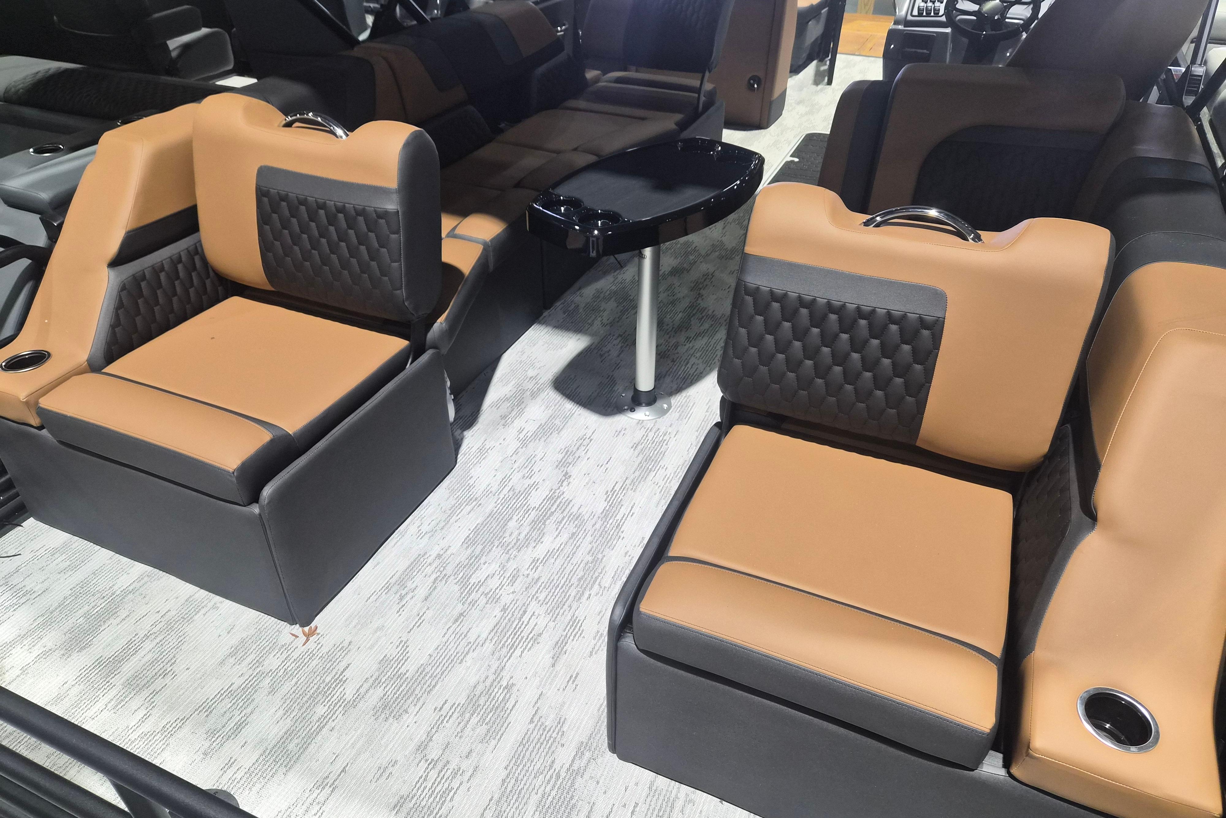 Luxurious interior seating of 2026 Sylvan L3 SLZ boat with tan and black upholstery.