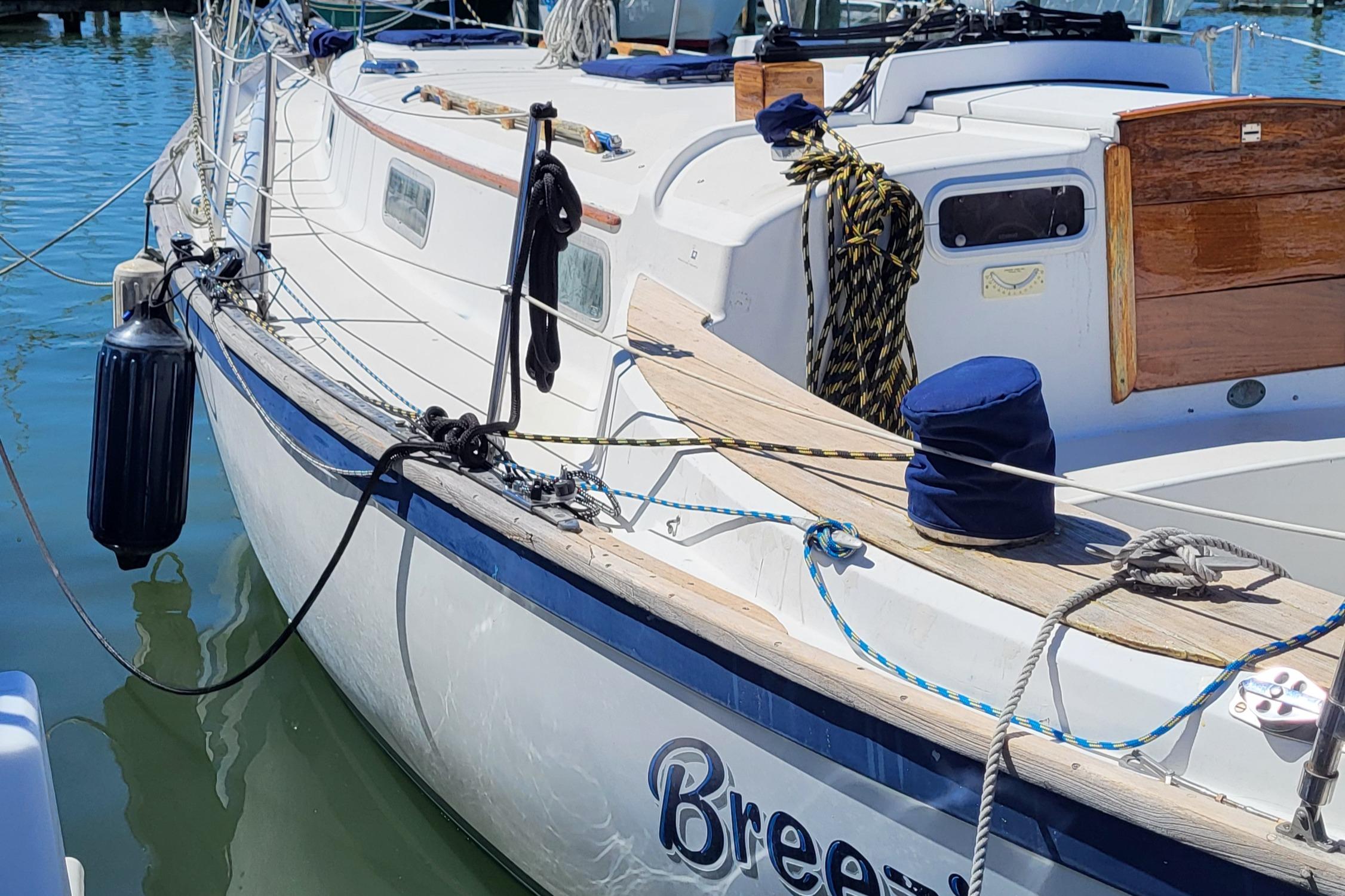 1979 Pearson 365 Sloop sailboat docked in marina, named "Breezy."