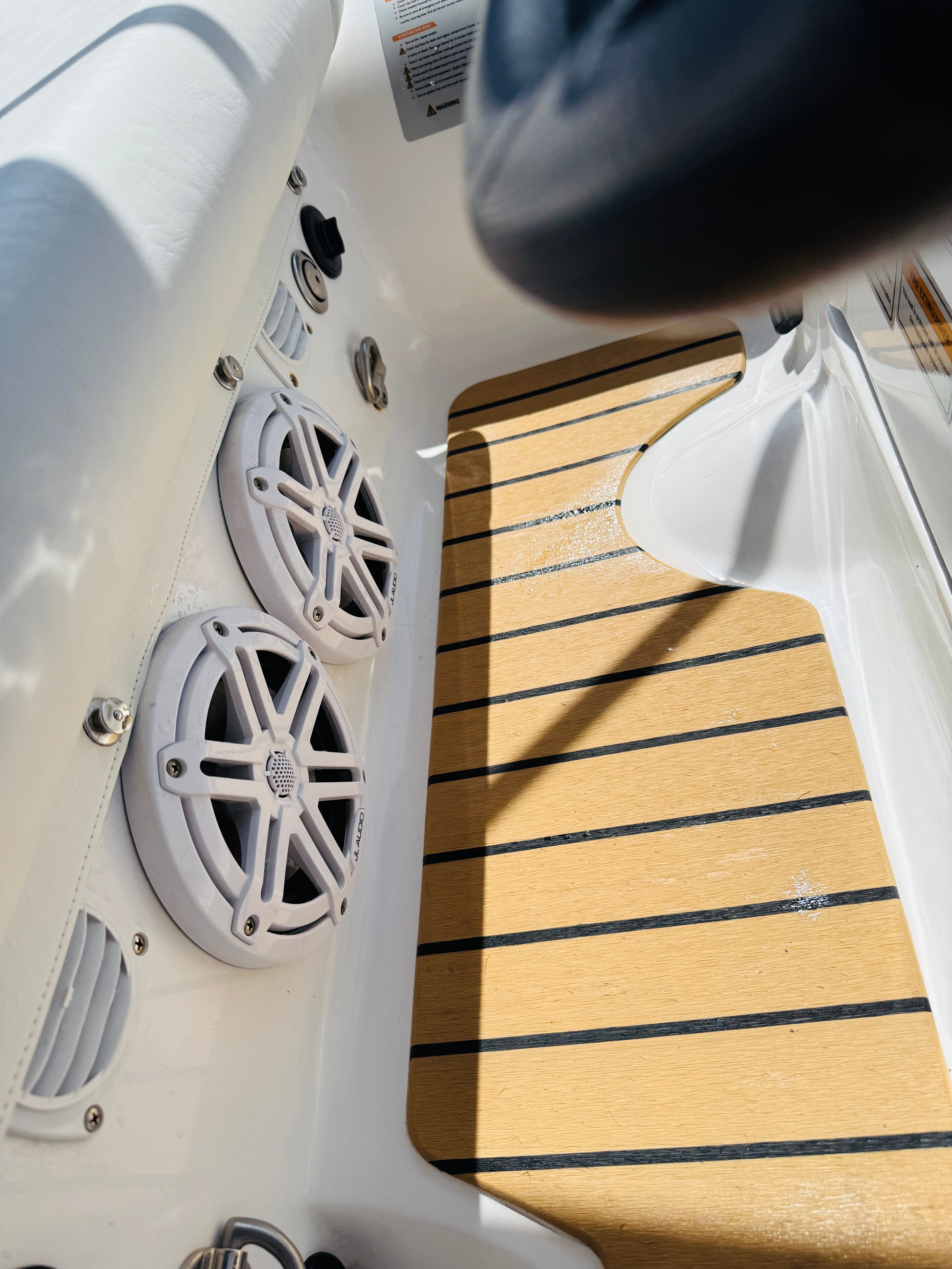 Interior of 2020 AB Inflatables ABJET 290 with speakers and wooden flooring.