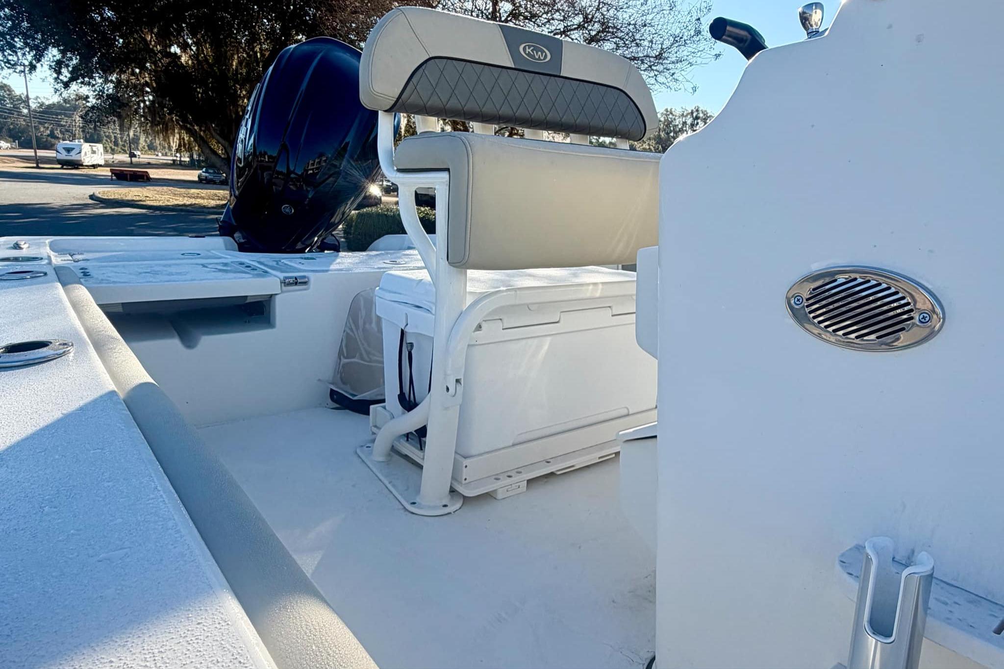 2026 Key West 210 Bay Reef boat interior with seating and storage features.