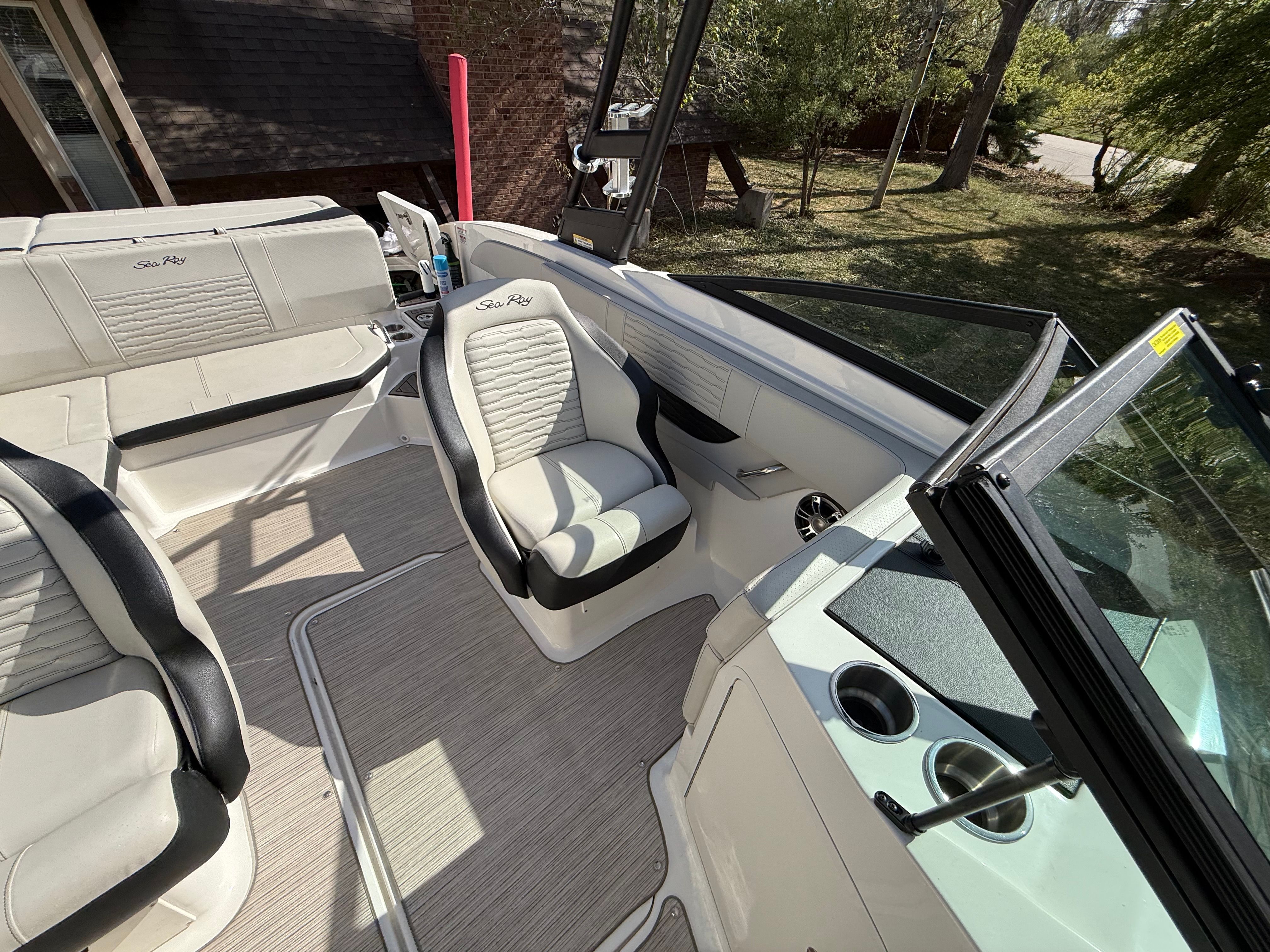 Interior of a 2022 Sea Ray SPX 210 boat with seating.