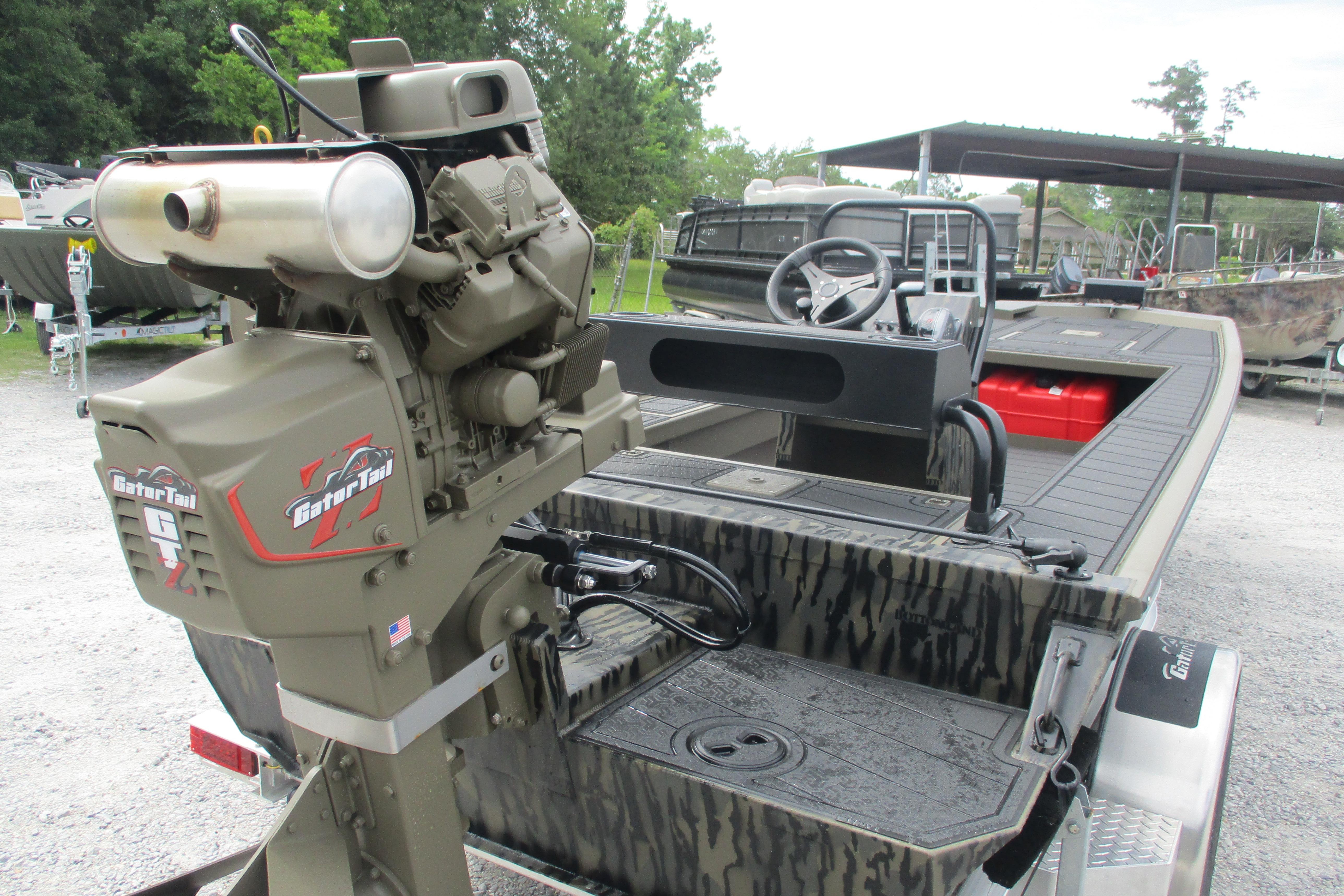 2026 Gator Tail 2060 Extreme CC boat with powerful outboard motor, camo design, and steering console.