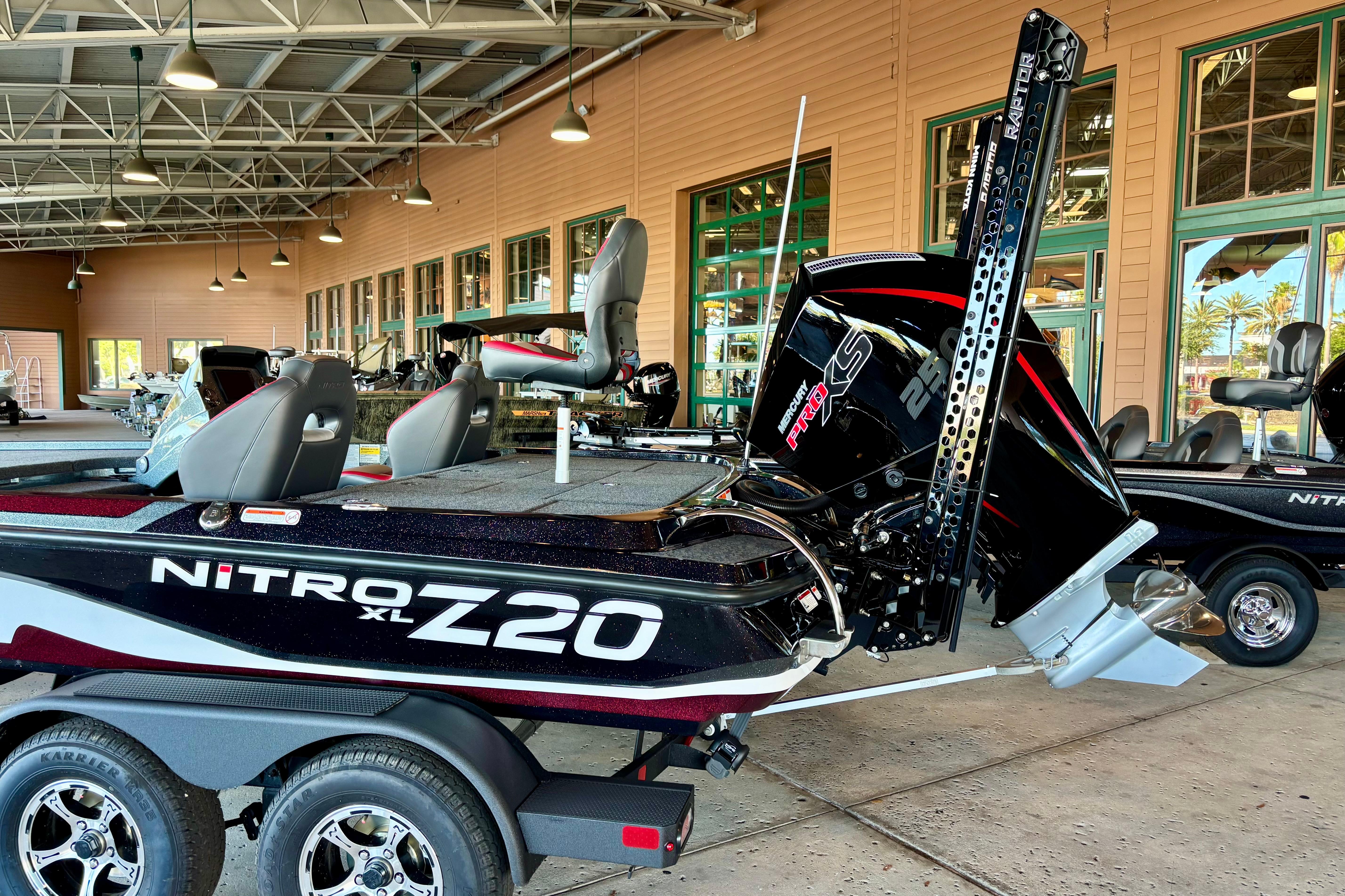 2026 Nitro Z20 XL Pro boat displayed indoors with powerful engine and sleek design.
