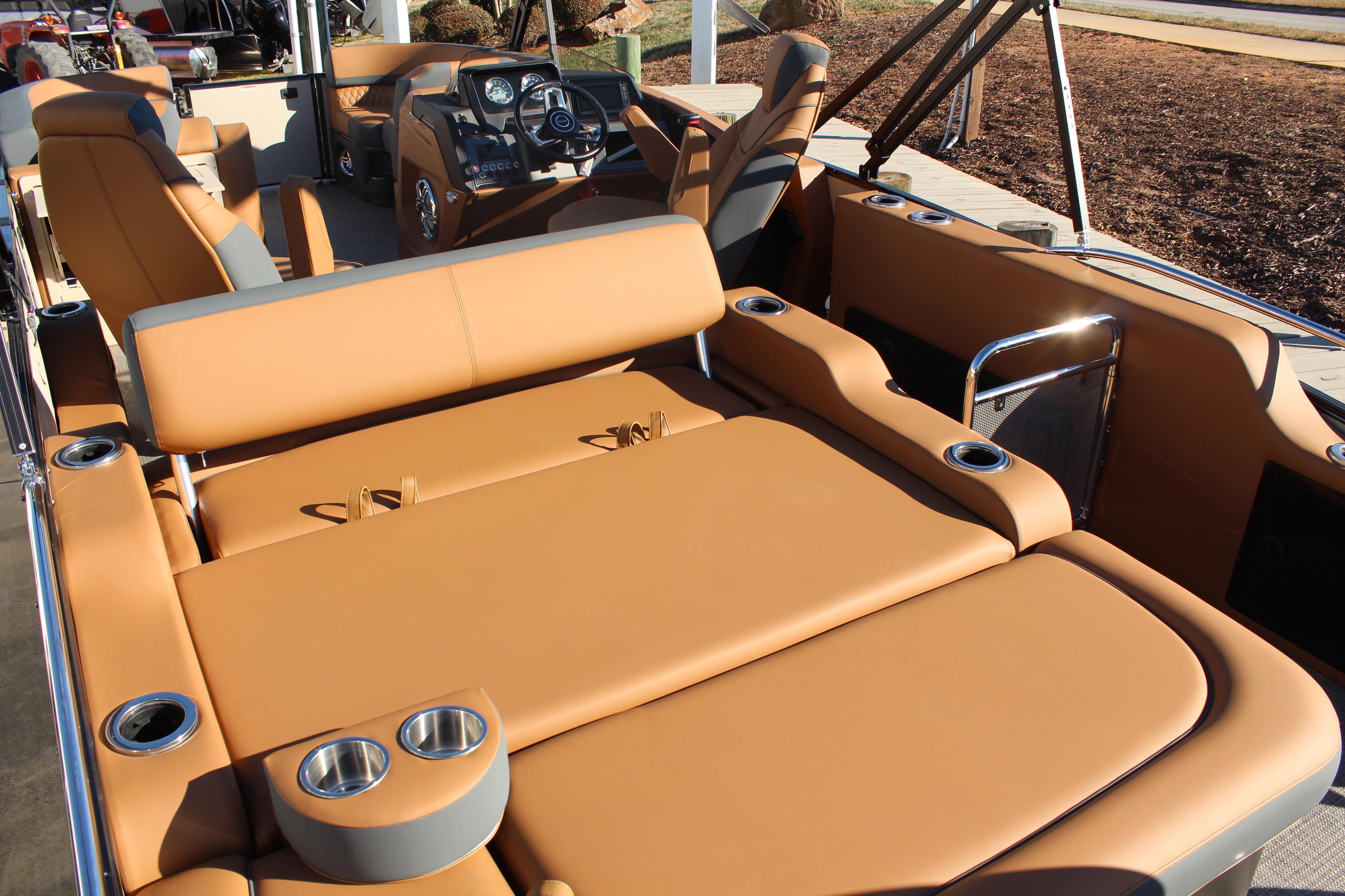 2026 Tahoe Pontoon Cascade Versatile Rear Bench with luxurious tan seating and cup holders.