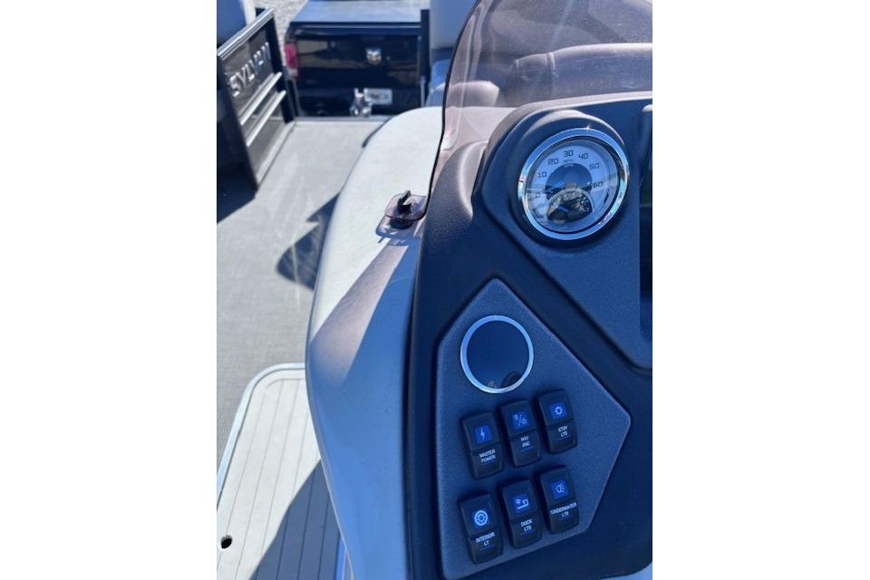 Control panel of 2022 Sylvan L3 DLZ Bar boat with speedometer and switches.