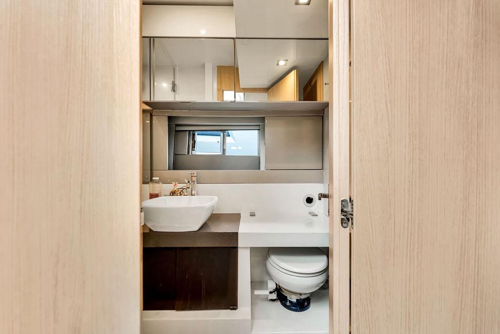 Luxurious bathroom interior of 2012 Fairline Targa 58 yacht, featuring modern sink and toilet.