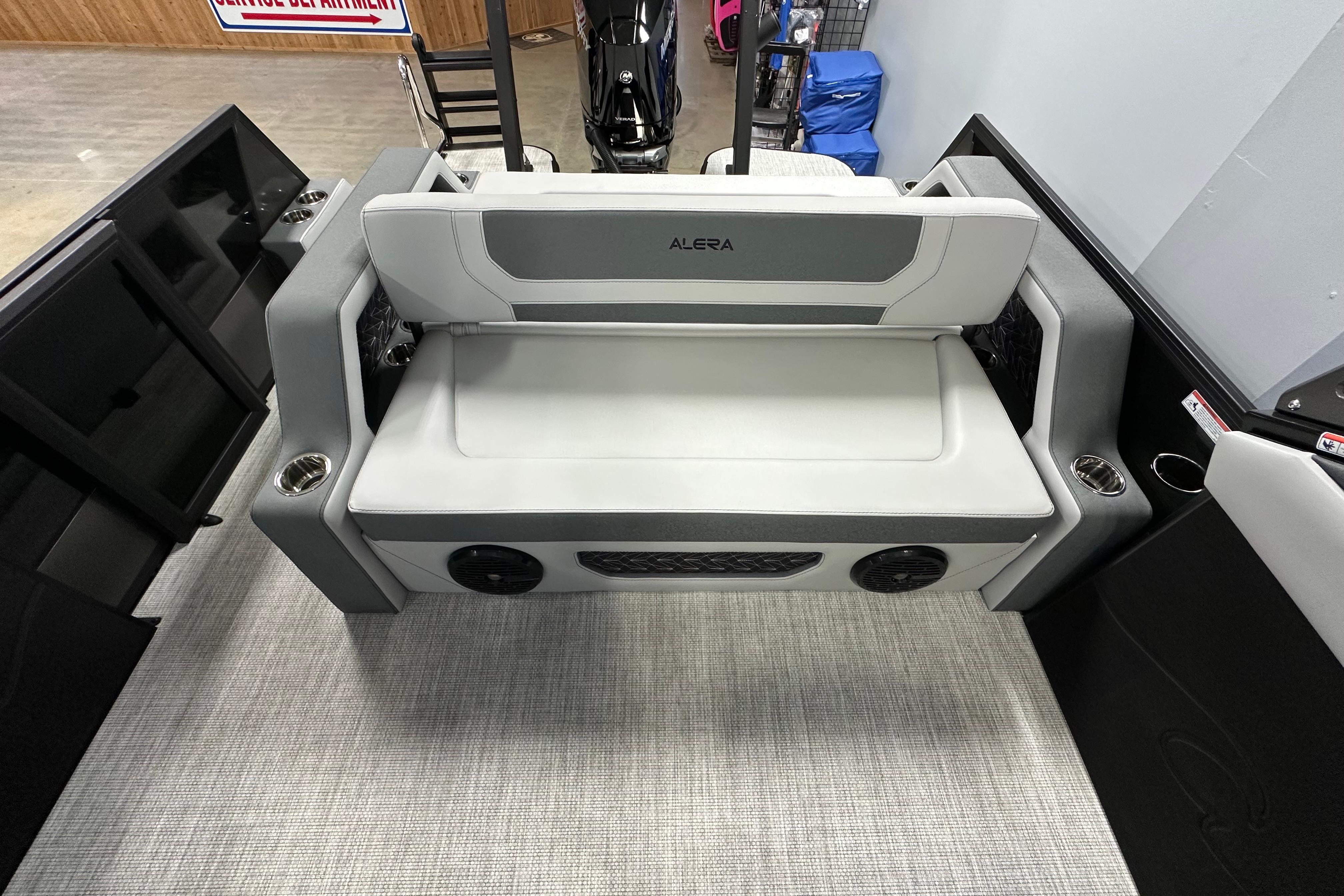 2026 Alera M25L boat interior with gray seating and cup holders.