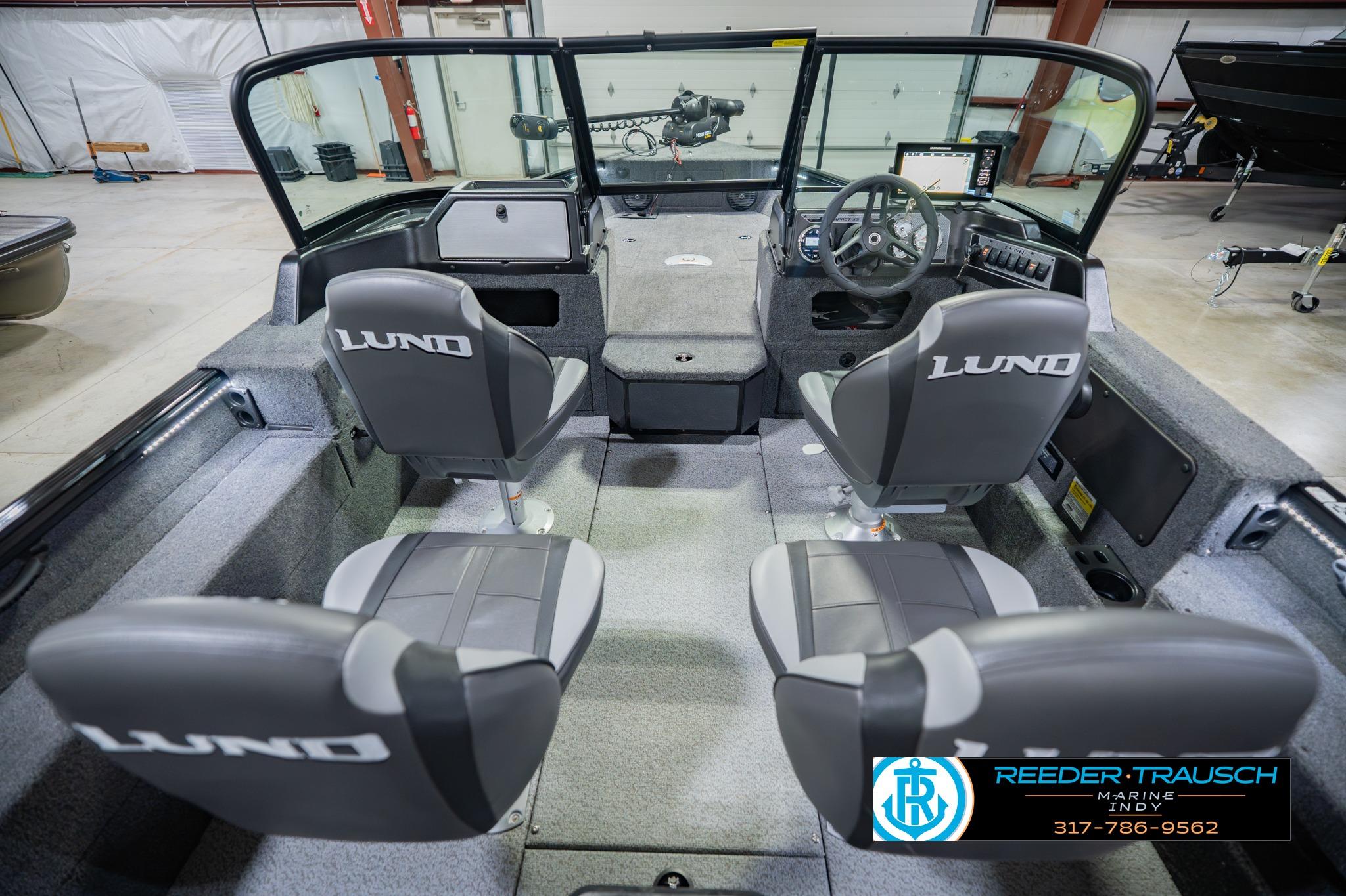 2026 Lund 1775 Impact XS boat interior with dual seats and steering console.