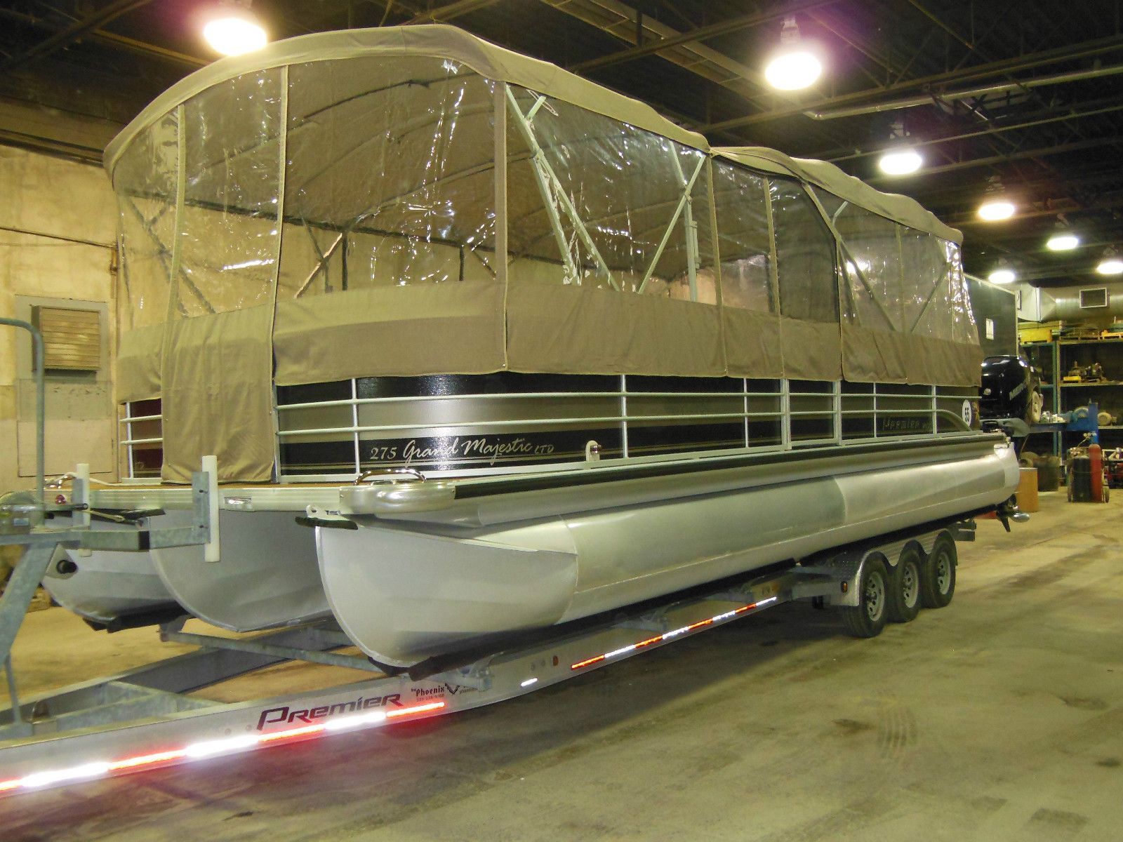 2009 Premier 275 Grand Majestic LTD pontoon boat in warehouse.
