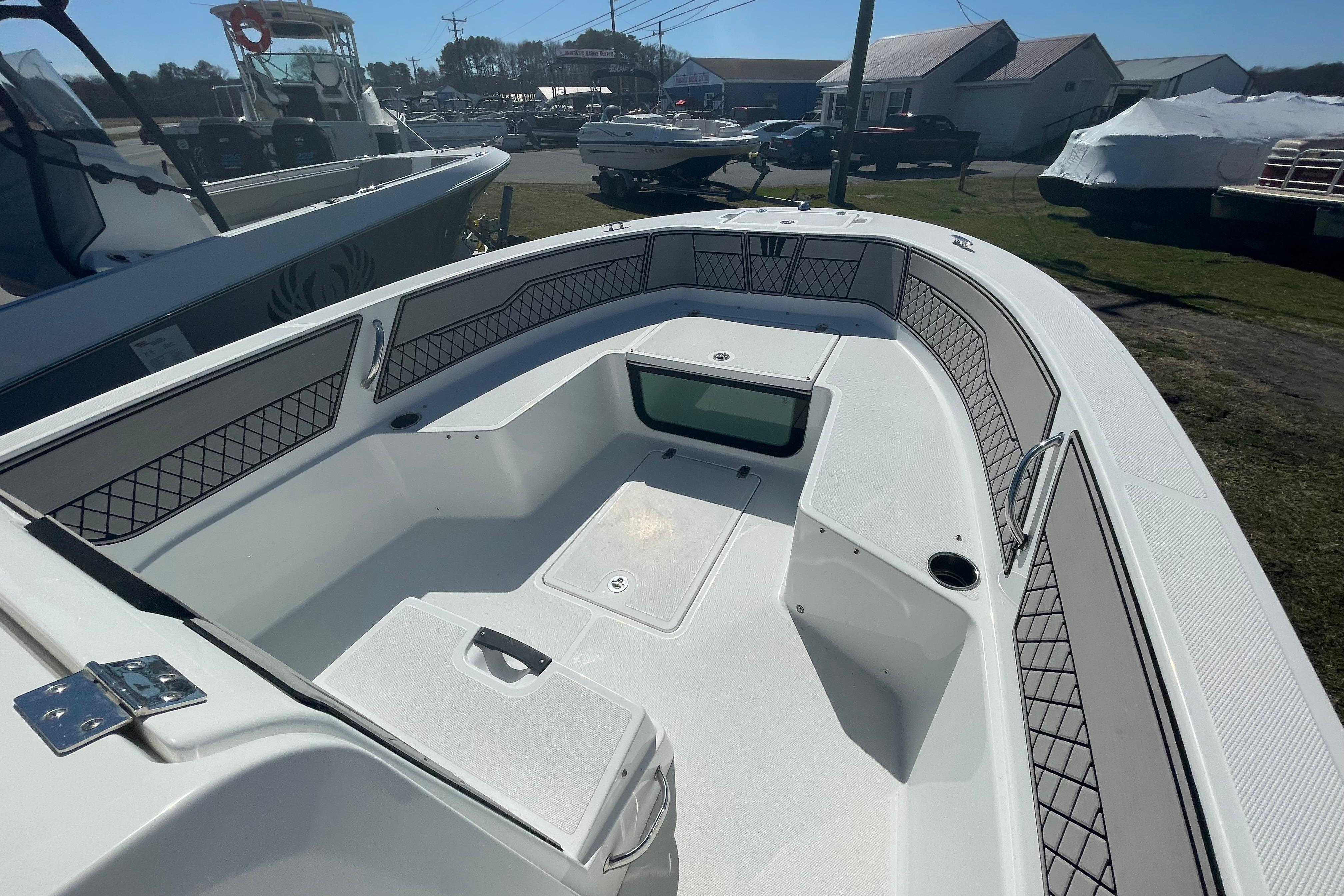 2022 Wellcraft 202 Fisherman boat interior with spacious seating and storage compartments.