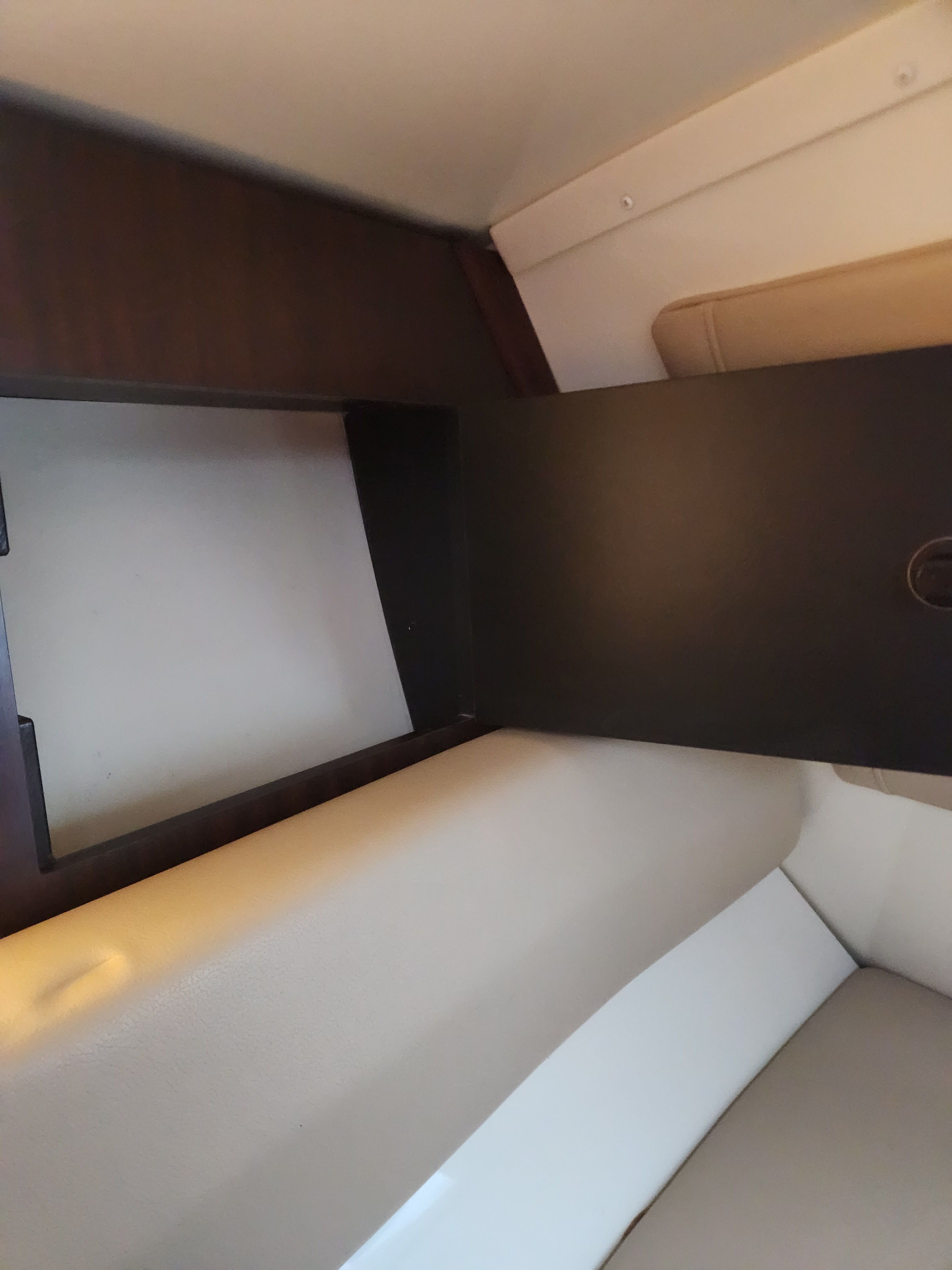Interior of a 2015 Monterey 268SSC boat, brown and beige upholstery.