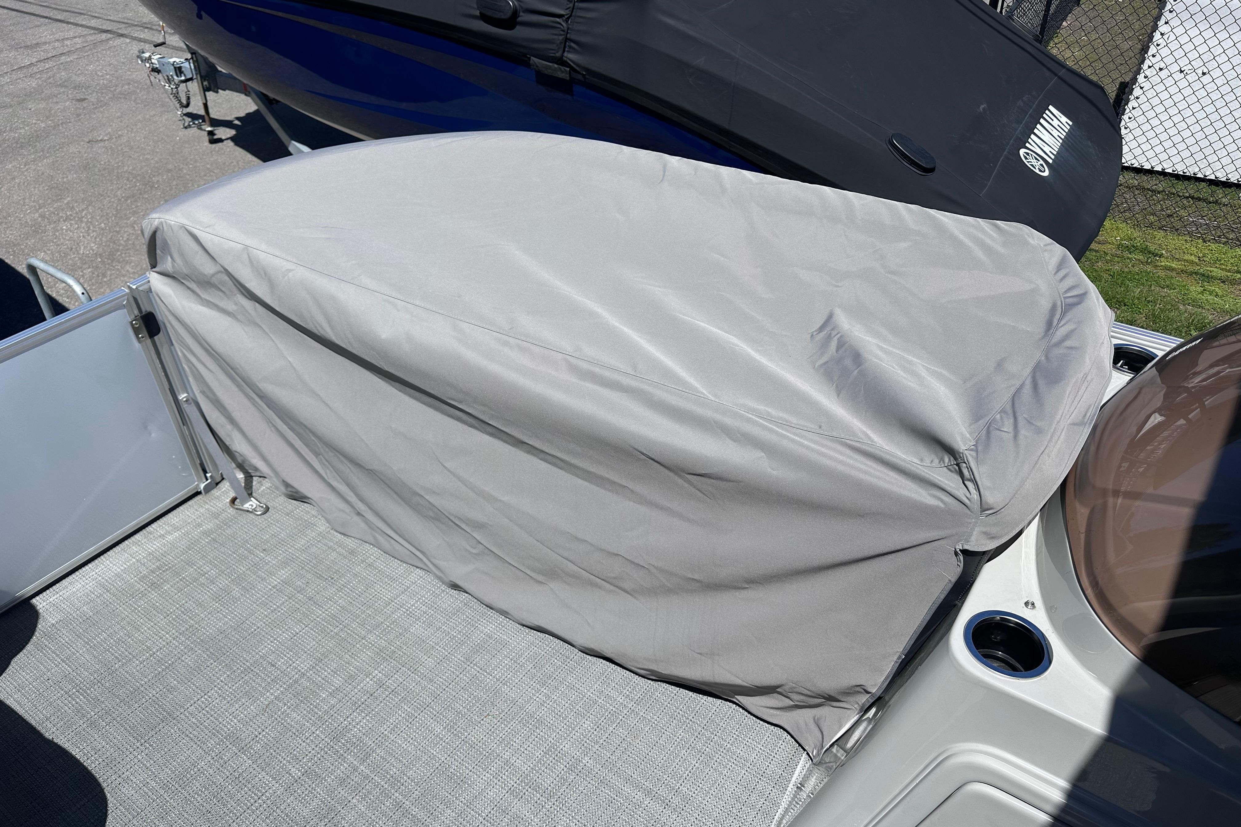 2024 Sylvan Mirage 8522 LZ boat seat covered with a protective gray cover.