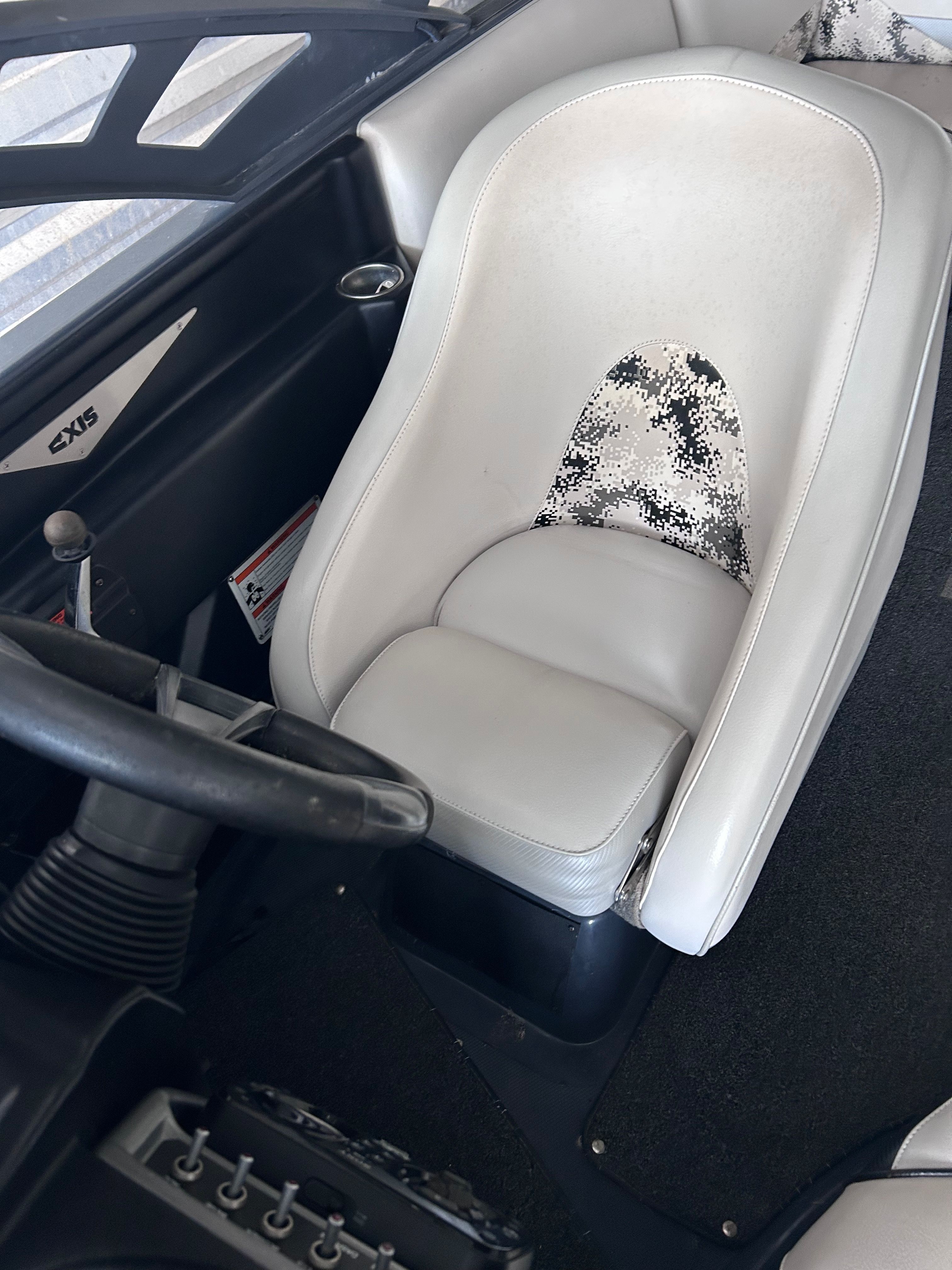 Interior of a 2013 Axis A22 boat with white seat.