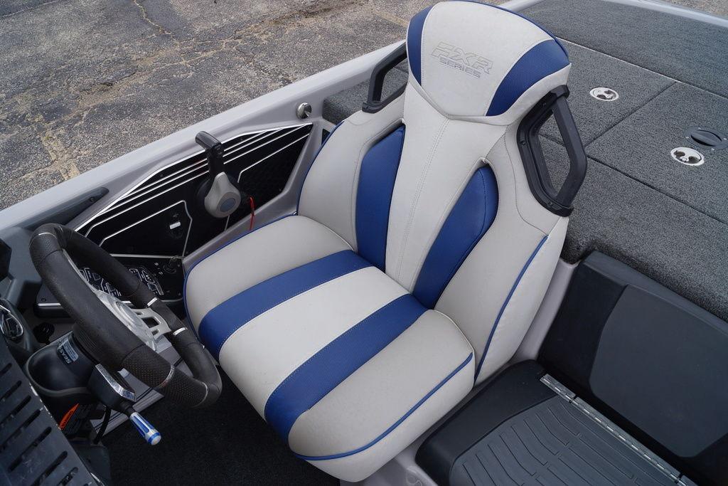 2020 Skeeter FXR21 Limited boat interior with blue and white seating and steering wheel.