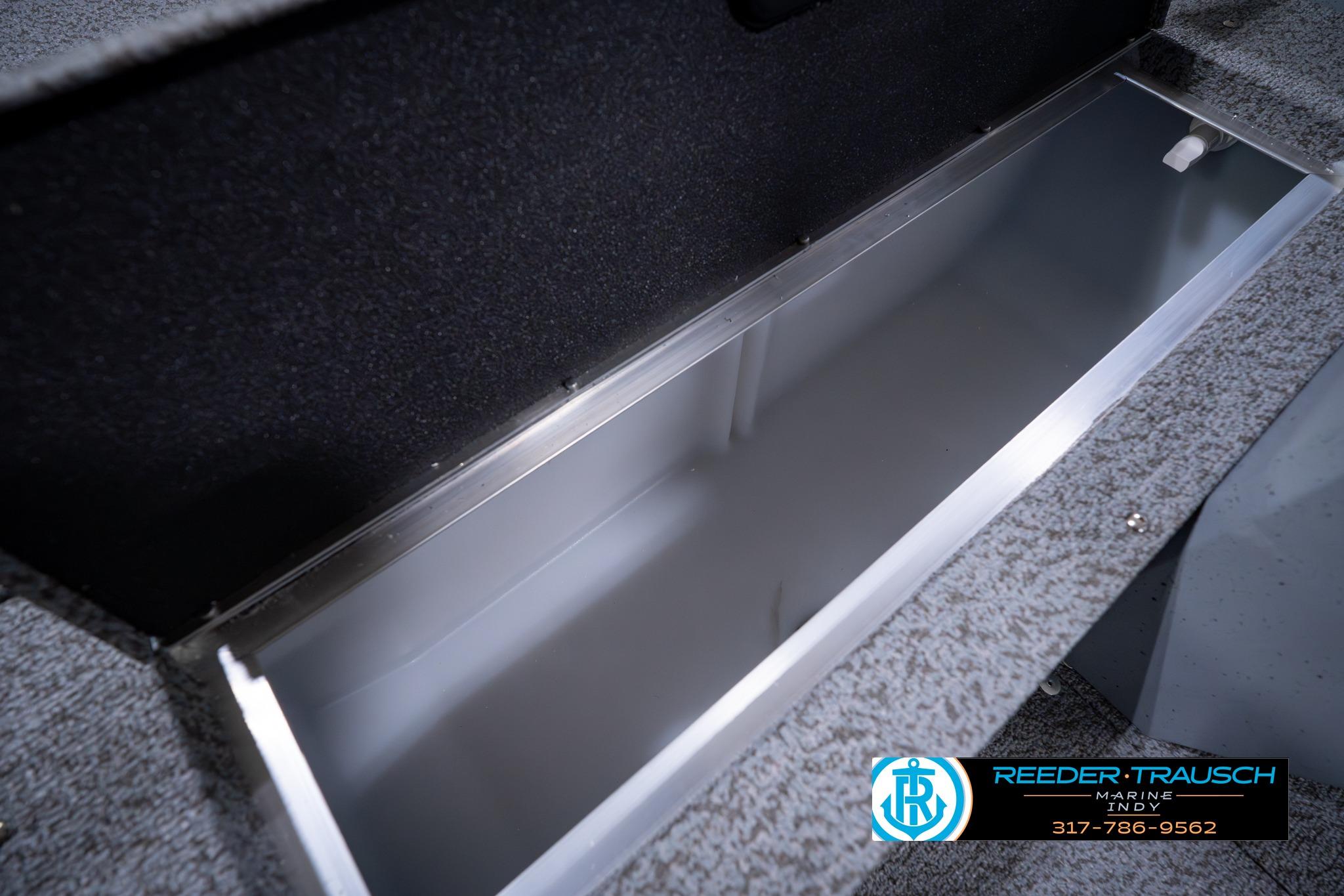 Interior storage compartment of 2026 Lund 1600 Fury SS boat, featuring sleek design.