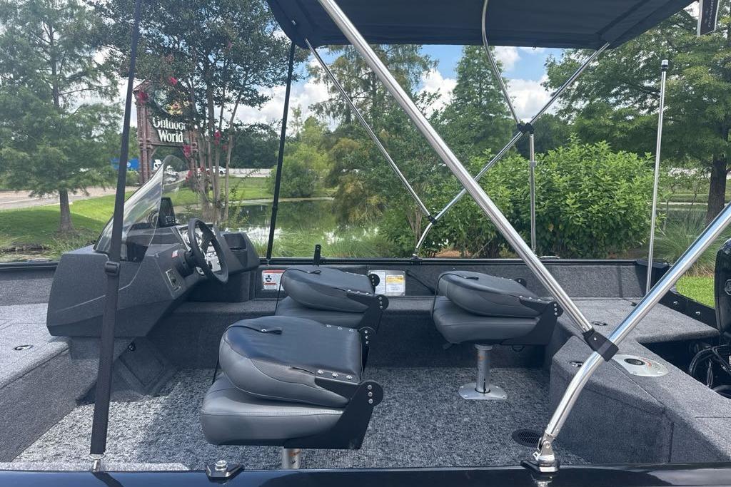 2026 Tracker Pro Guide V-16 SC boat interior with seating and steering wheel.