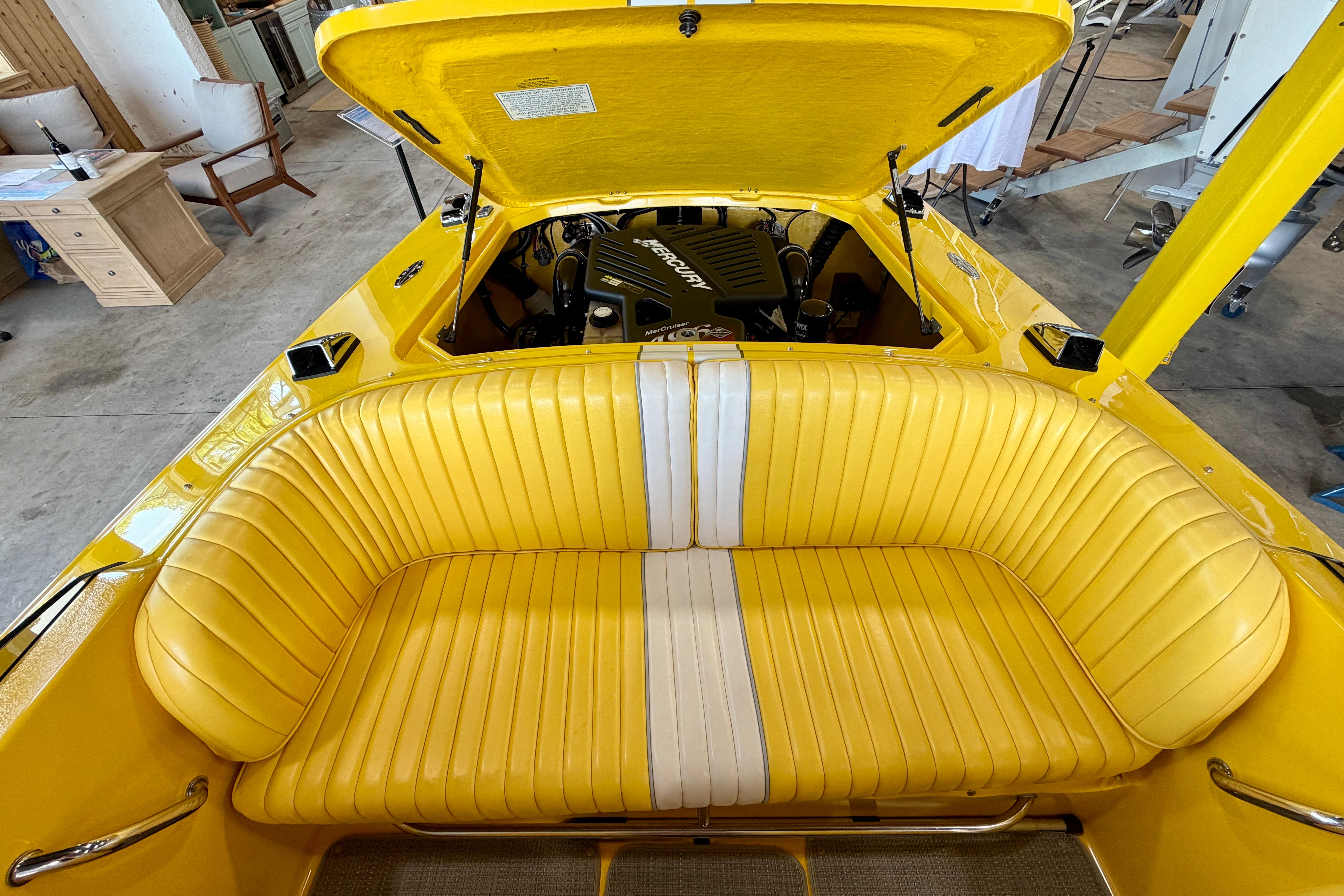 Yellow 2004 Donzi 22 Classic boat interior with open engine compartment.