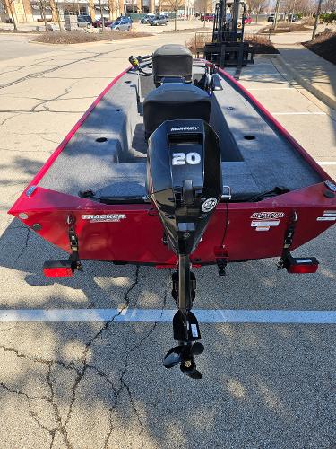 2025 Tracker Panfish 17 boat with Mercury 20 outboard motor, parked in a lot.