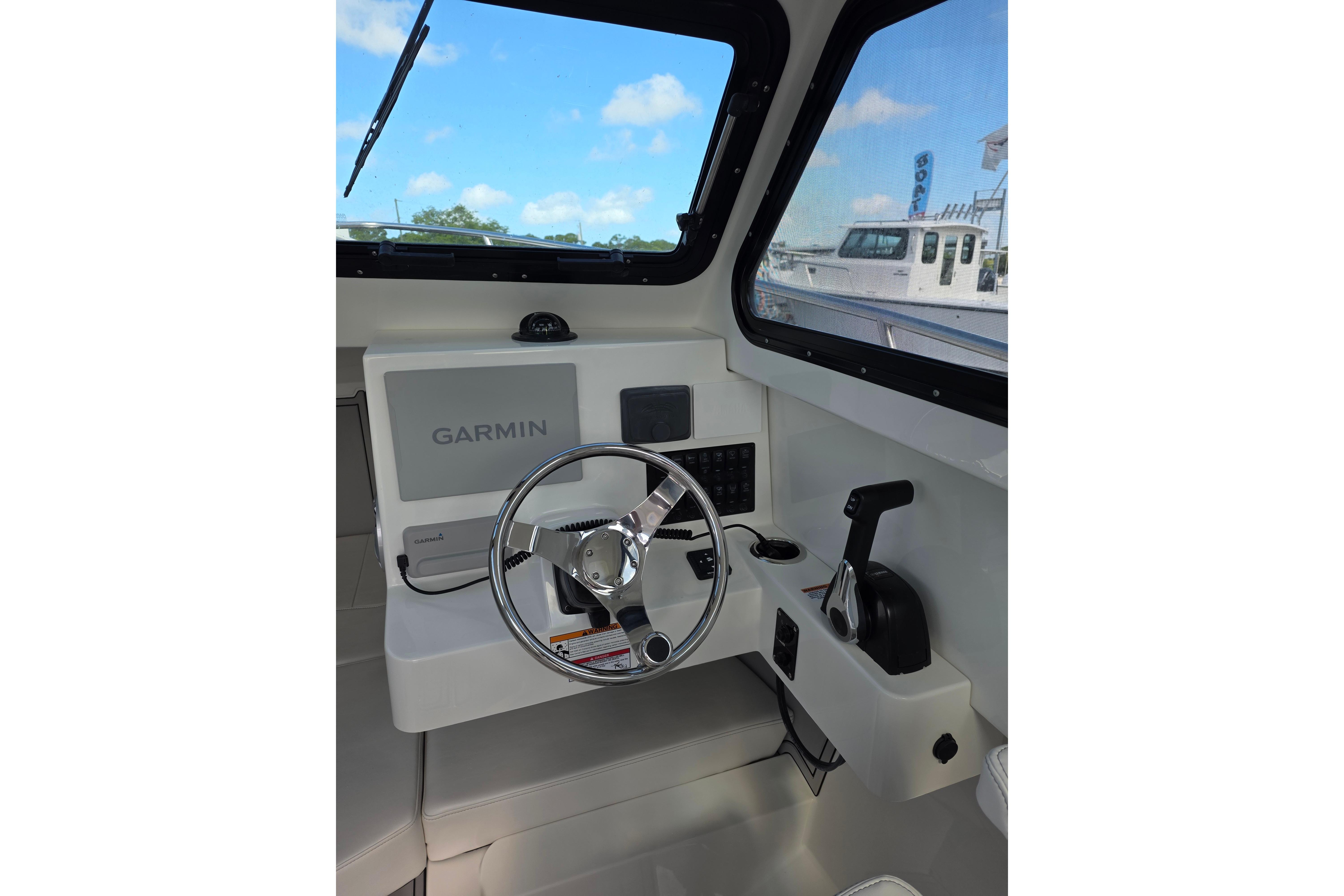 Interior helm of 2026 Parker 227 Explorer boat with Garmin navigation system.