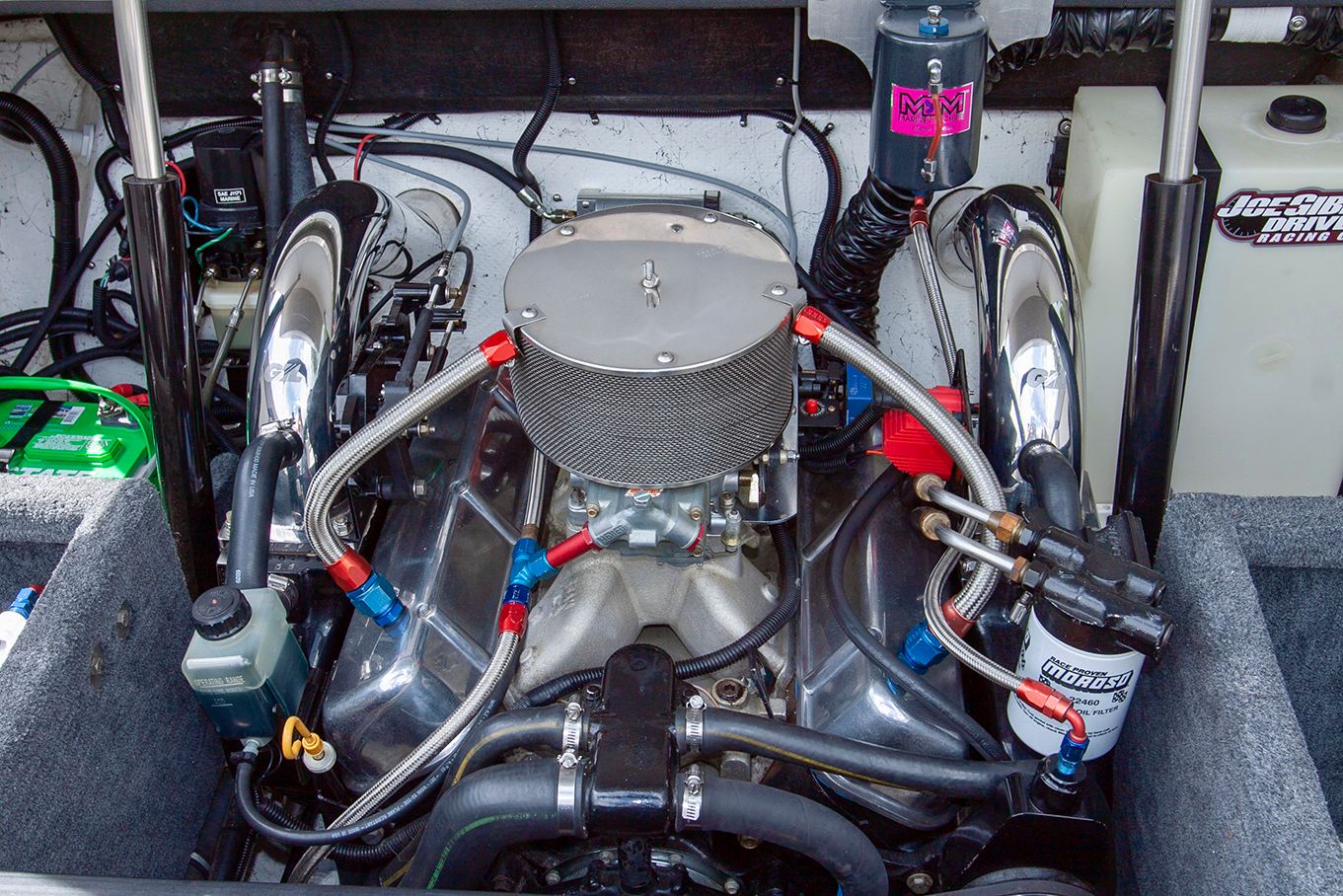 Engine compartment of a 1995 Mirage Trovare 275 boat with high-performance engine.
