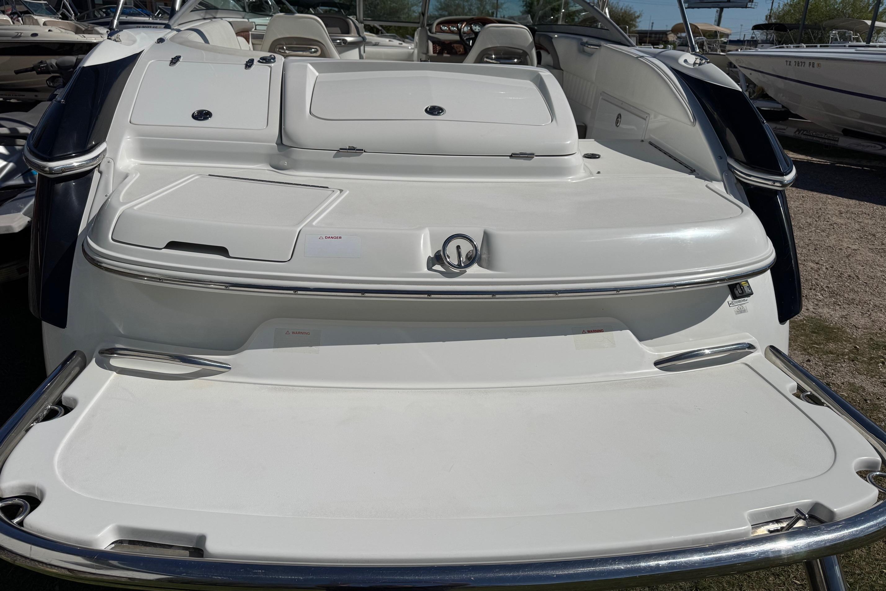 2005 Cobalt 240 boat stern view with swim platform and seating area.