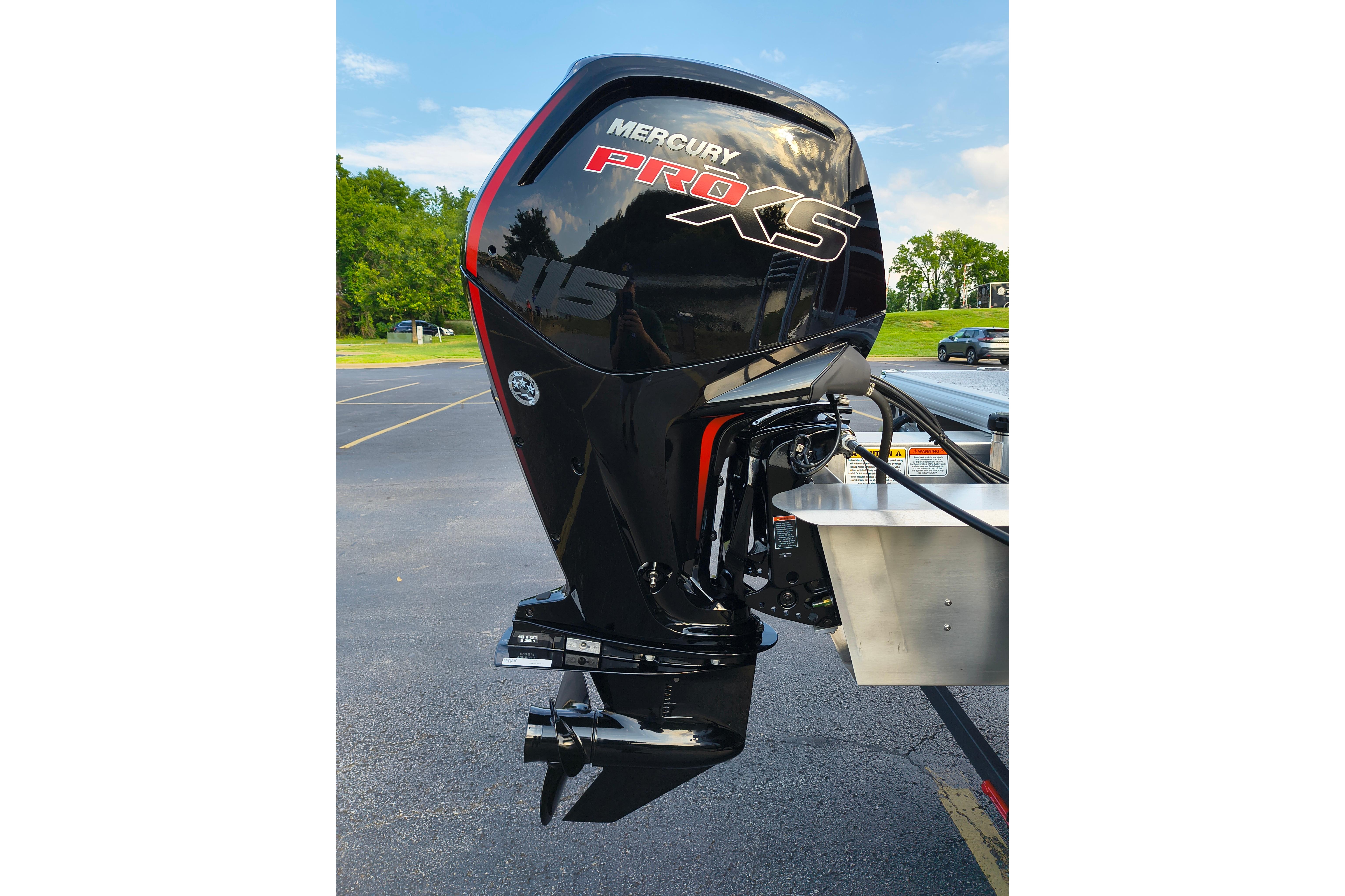2026 Sun Tracker Fishin' Barge 22 DLX with Mercury Pro XS outboard motor.
