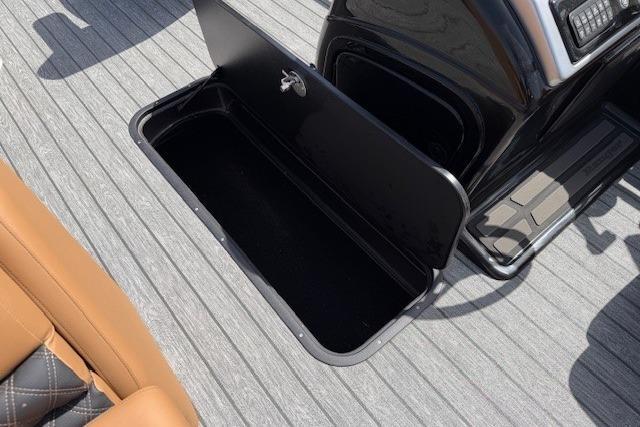 2026 Ranger 223F boat storage compartment with open lid on sleek deck.