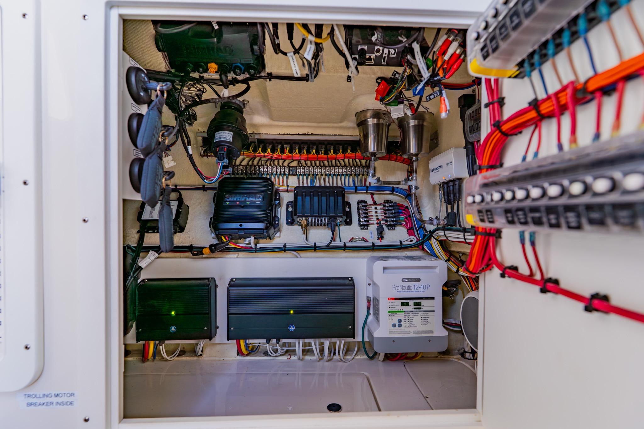Electrical panel of 2025 SeaVee 370Z boat, showcasing wiring and components.