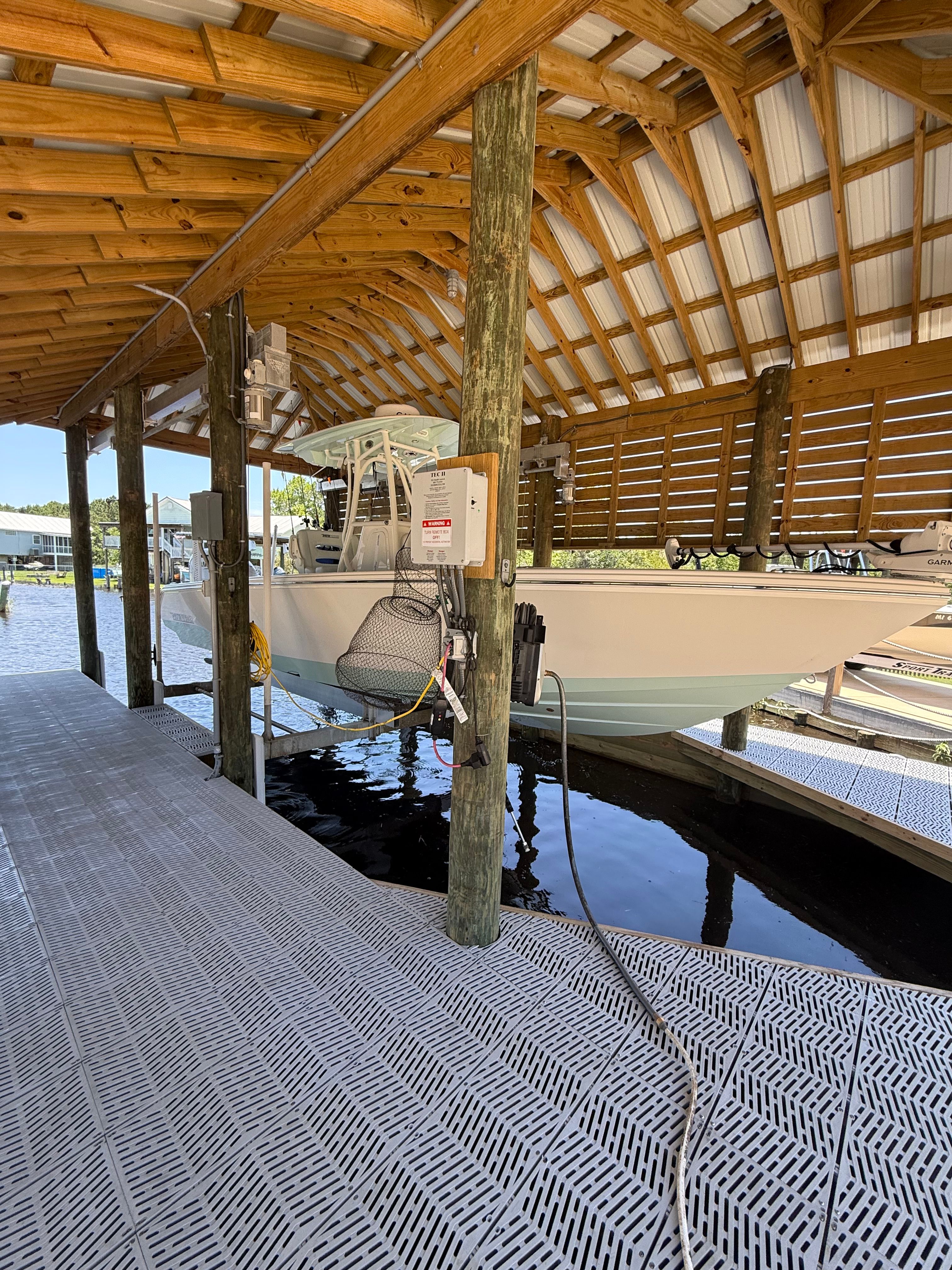Pathfinder 2700 Open 2024 in covered boathouse.