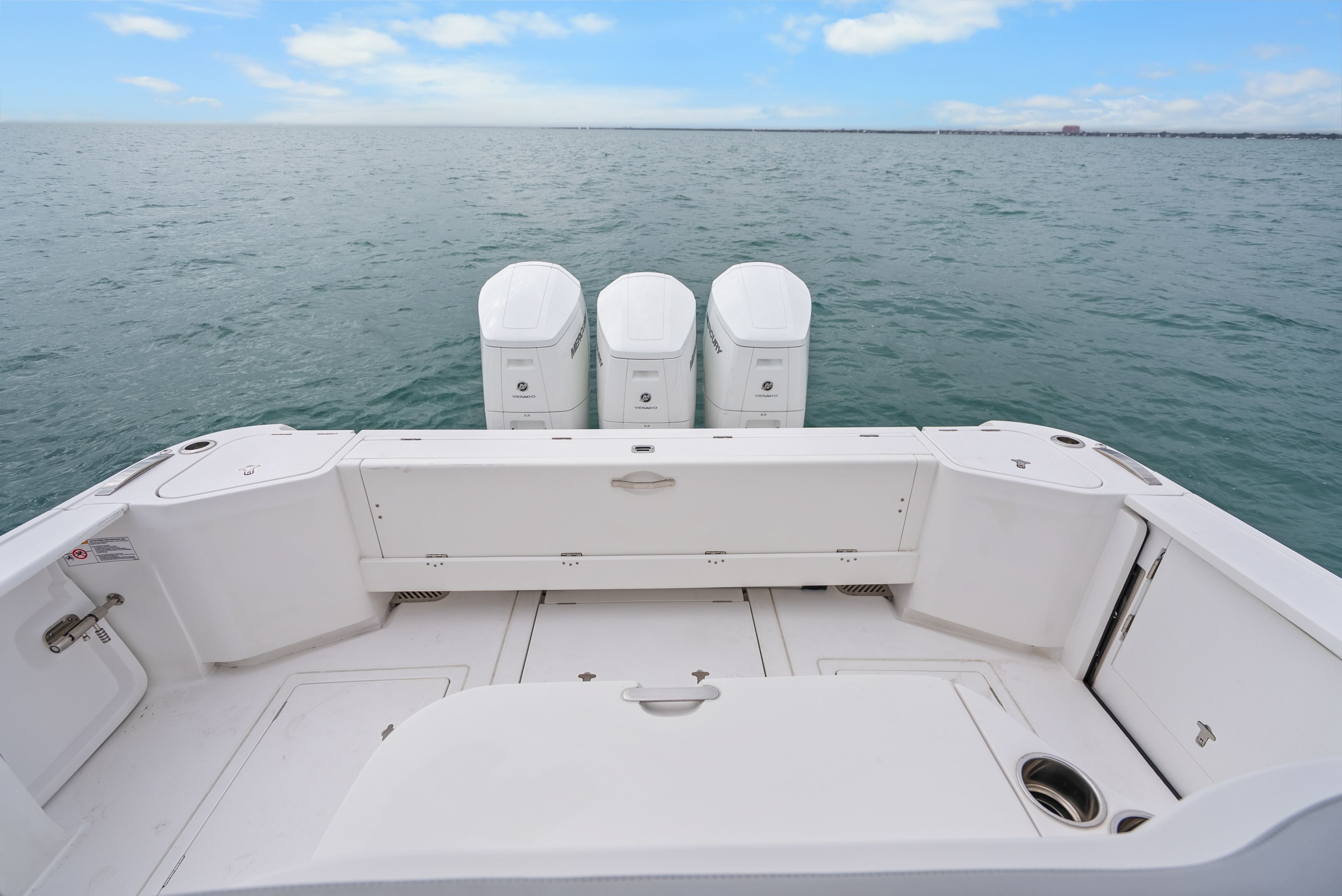 Rear view of 2024 Intrepid 477 Evolution on open sea.