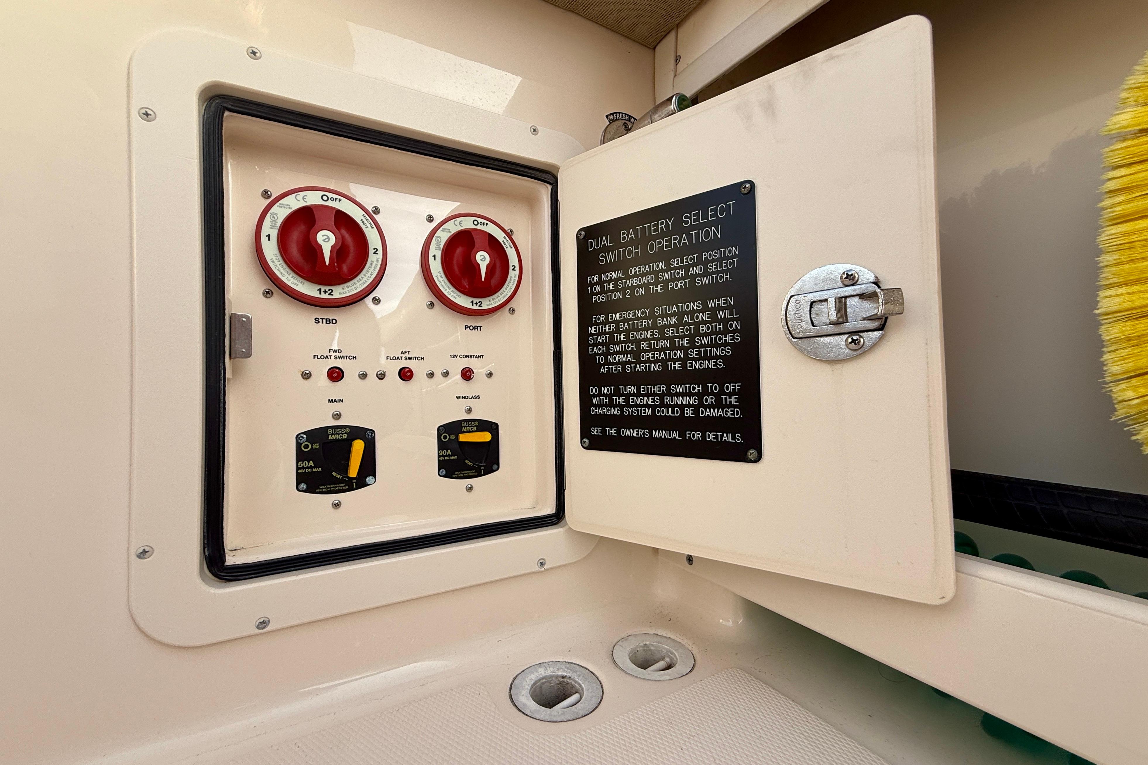Dual battery switch panel on 2012 Grady-White Canyon 336 boat, featuring operation instructions.