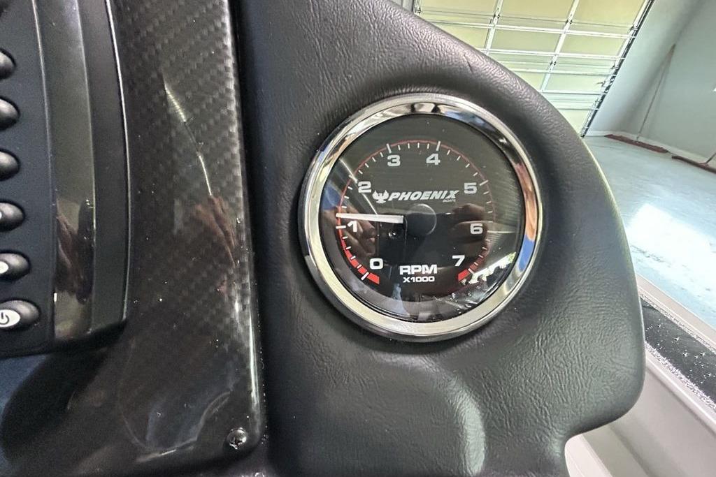 Tachometer of 2026 Phoenix 818 Pro, displaying RPM in a sleek dashboard.