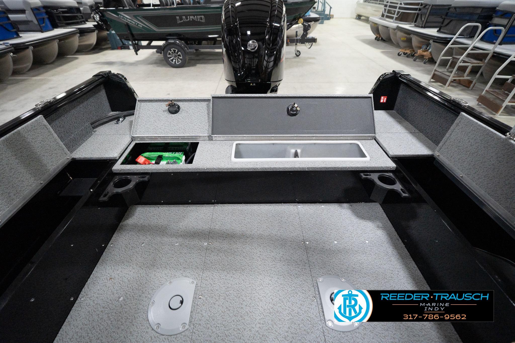2026 Lund 1800 Explorer Sport boat interior with storage compartments and sink.