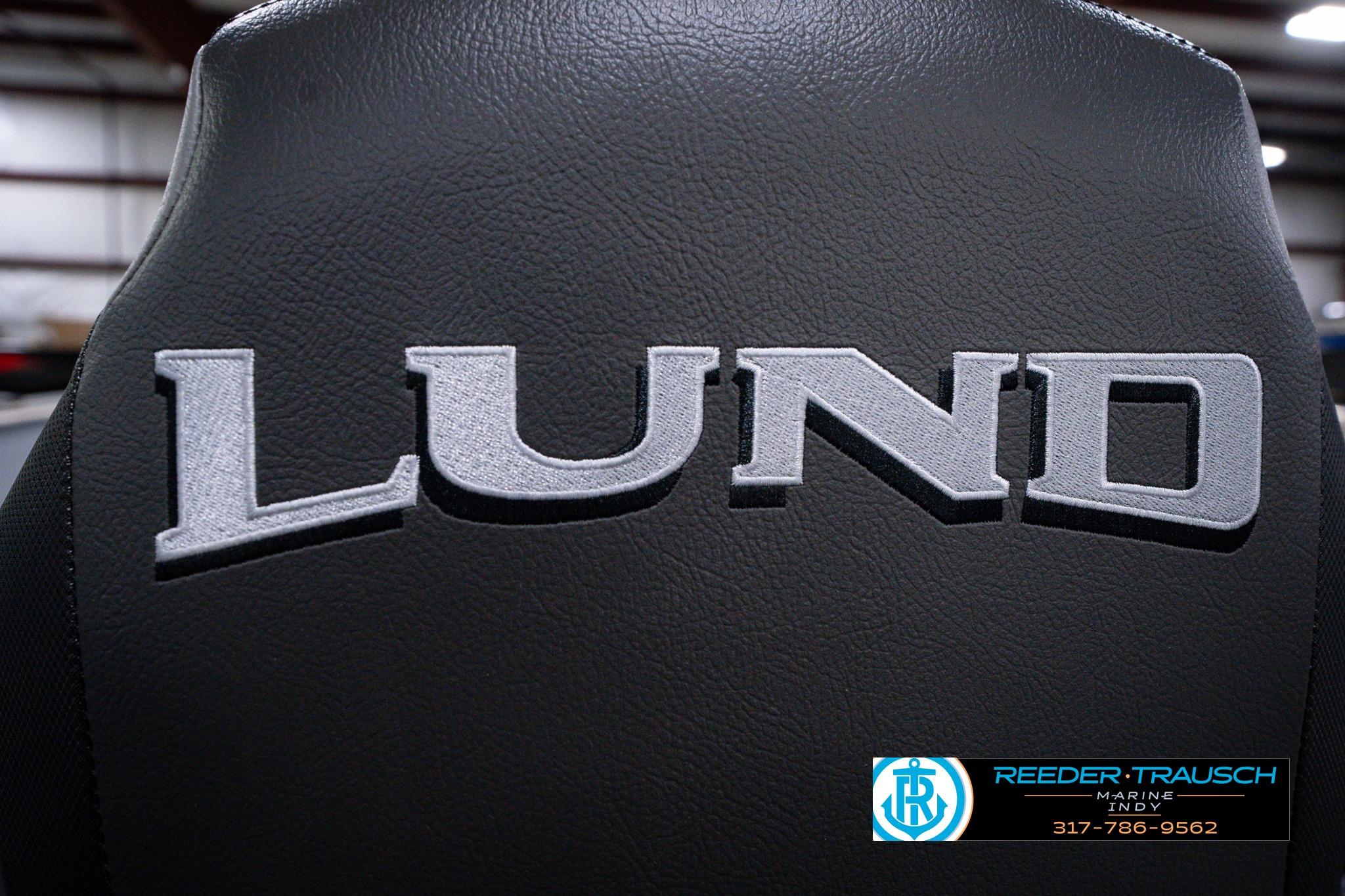Lund 1600 Fury SS 2026 boat seat with logo, featuring Reeder-Trausch Marine contact details.