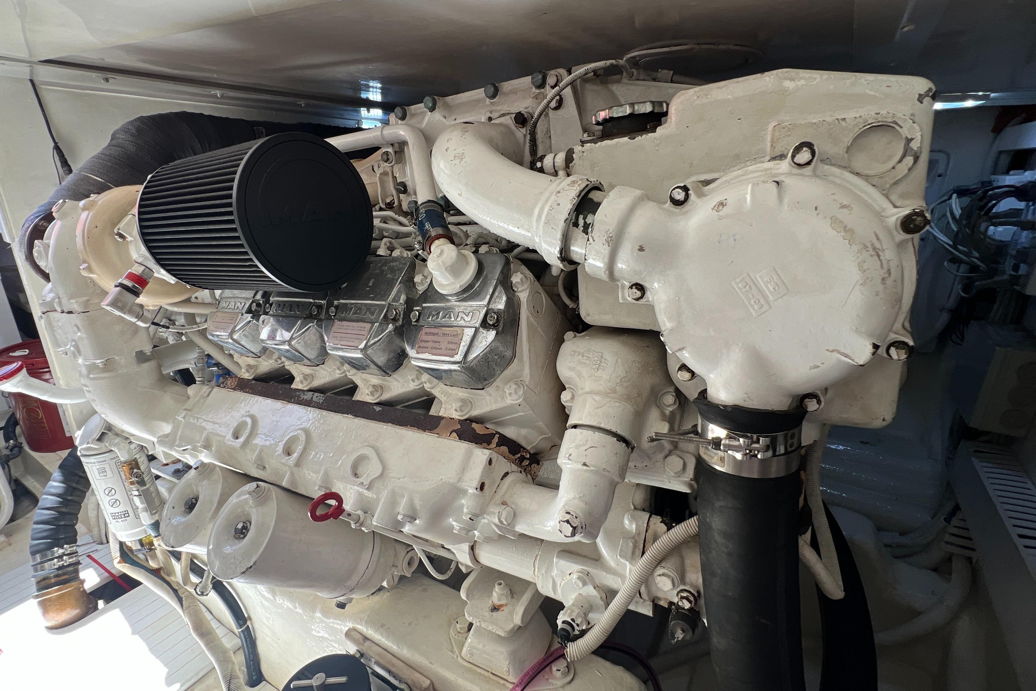 Engine of a 2005 Bertram 450 boat, showcasing detailed mechanical components.