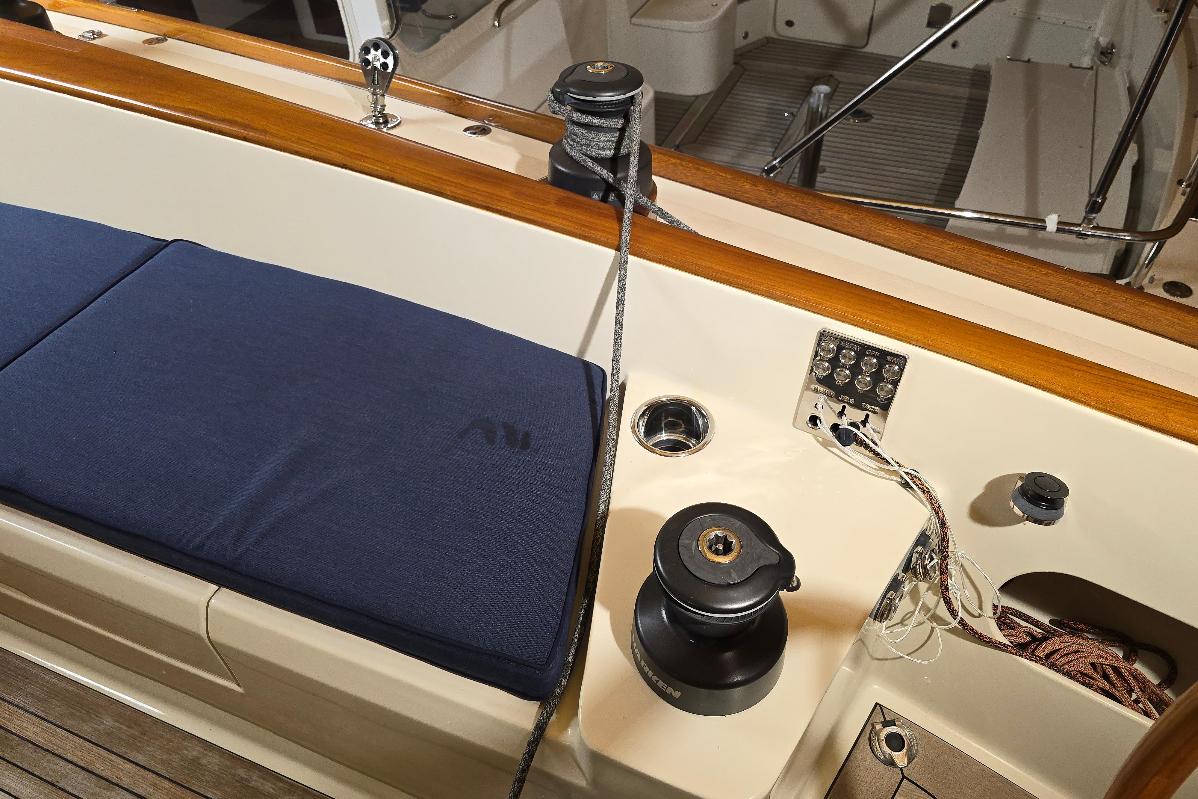 Interior of 2016 Morris M36 sailboat with blue cushion and winch.