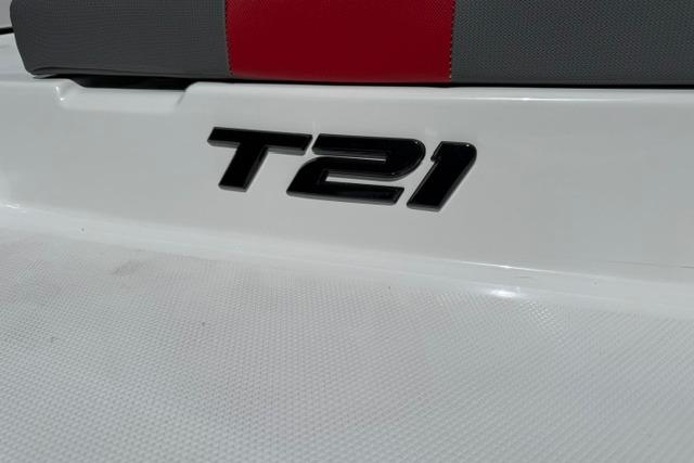 2026 Tahoe T21 model emblem on a white surface with red and gray accents.