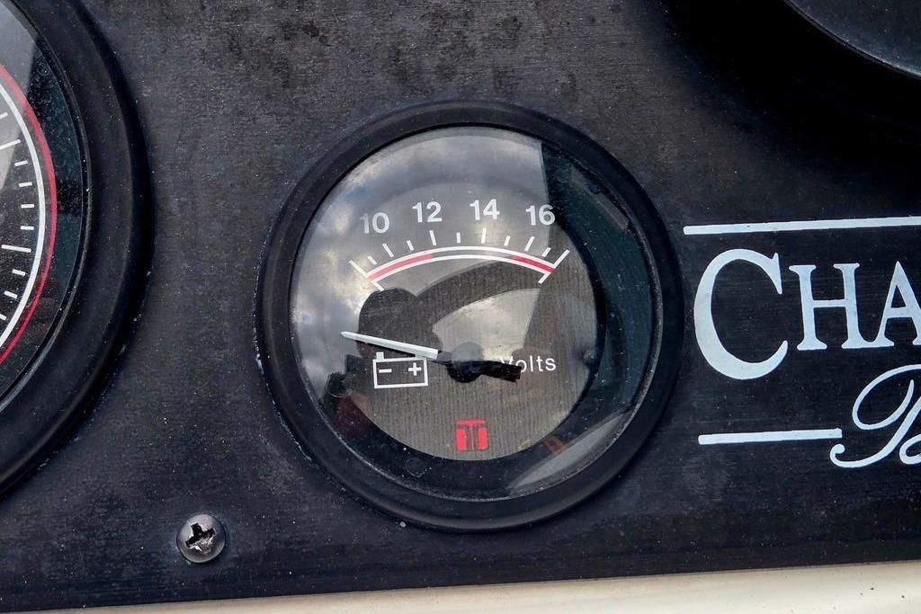 Voltmeter gauge on 1996 Champion 181 SX dashboard, displaying voltage levels.