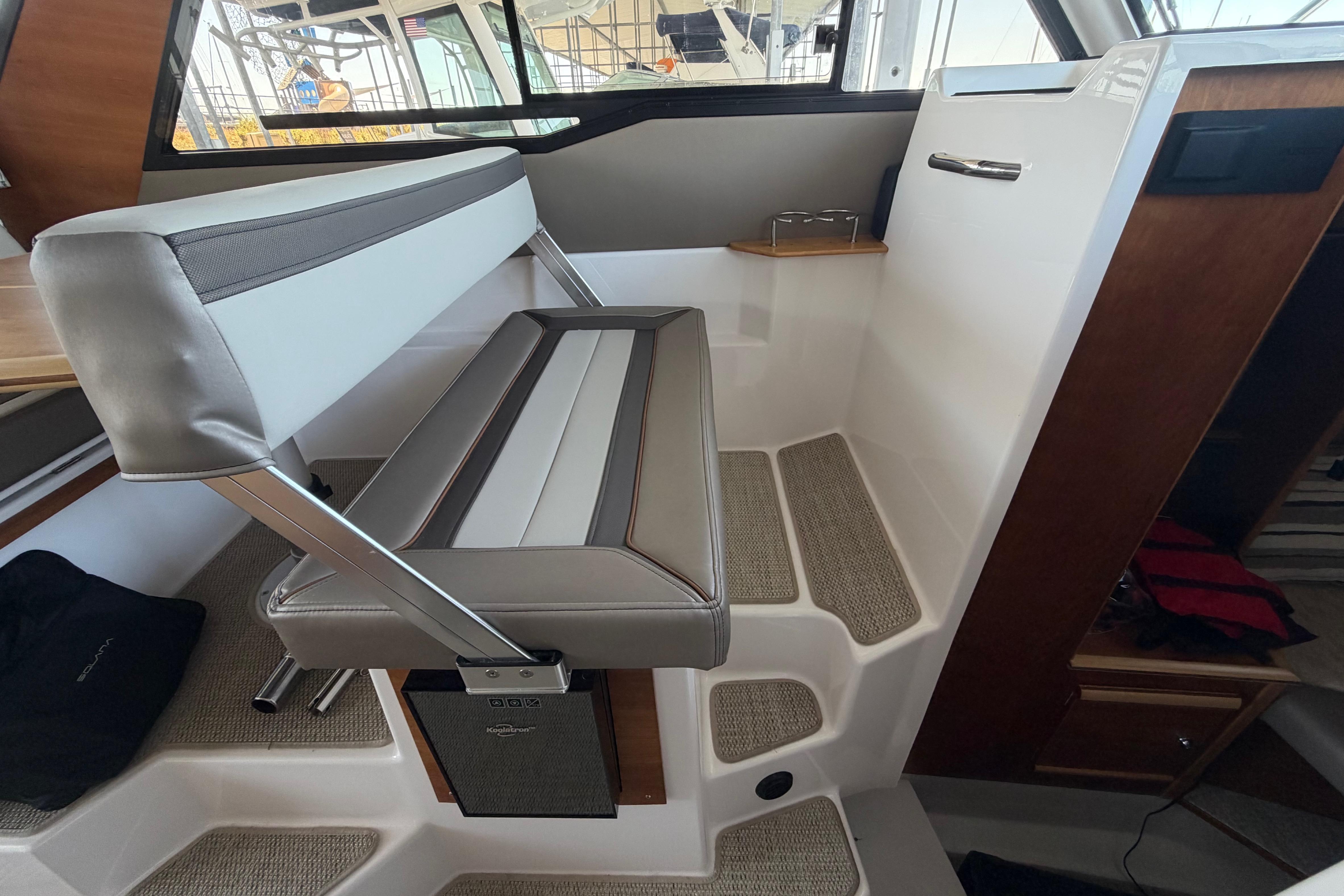 Interior seating of 2023 Cutwater C-288 Coupe boat, featuring modern design and comfortable upholstery.