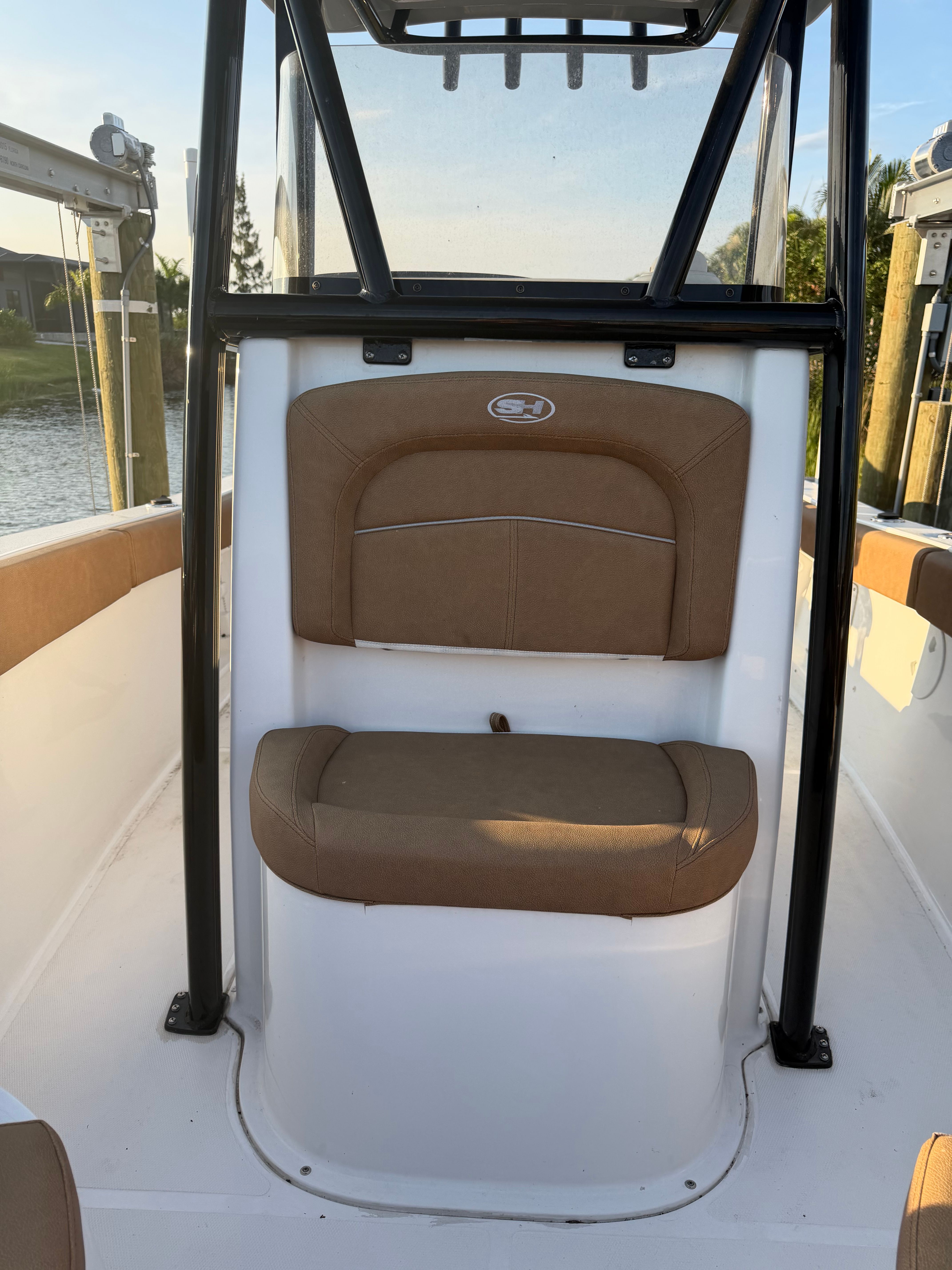 2024 Sea Hunt Ultra 219 with brown seating and black frame.