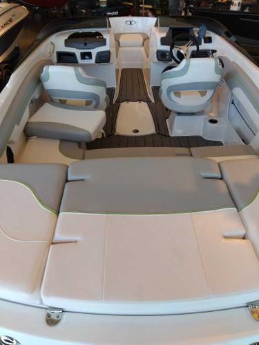 2023 Tahoe 210 Si Limited boat interior with seating and steering console.