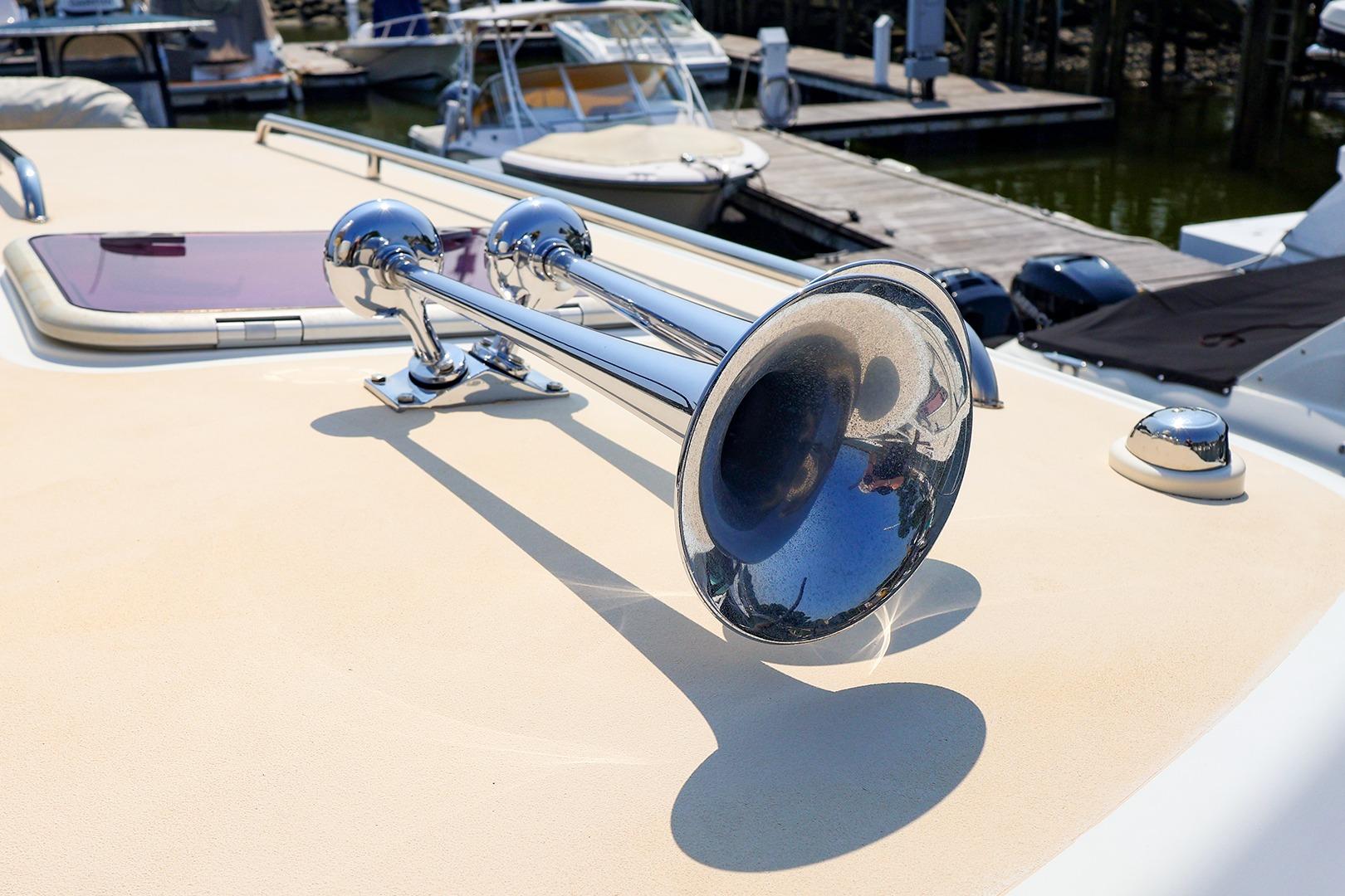 Chrome horn on 2010 MJM 40z Downeast boat, docked at marina.