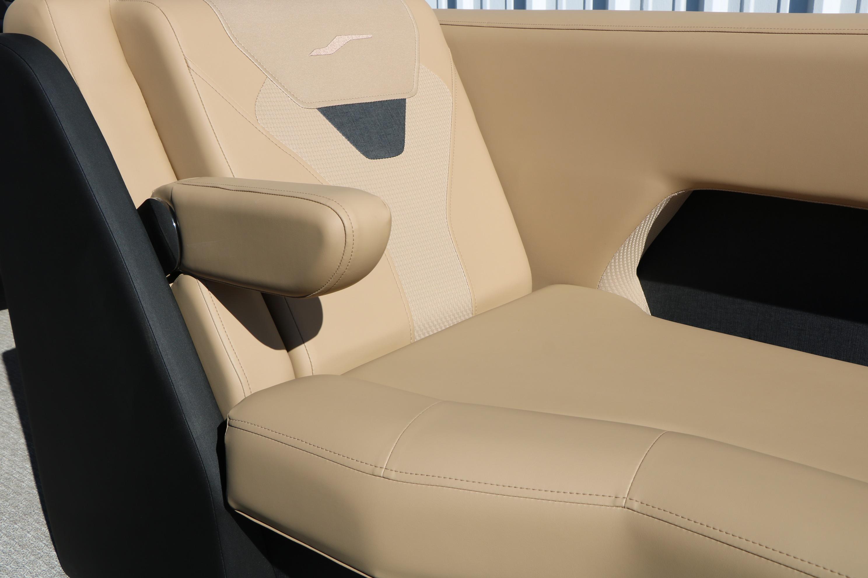Luxurious beige seating in 2026 Evotti 525 QL Tri-Toon boat.