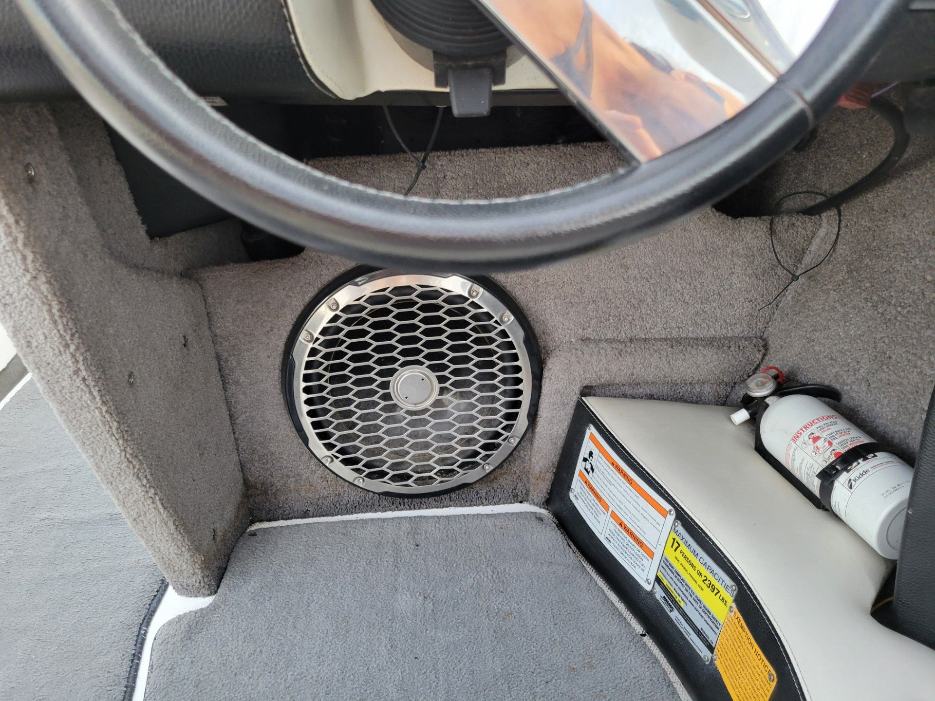 Interior of a 2011 Malibu Wakesetter 247 LSV with speaker and fire extinguisher.